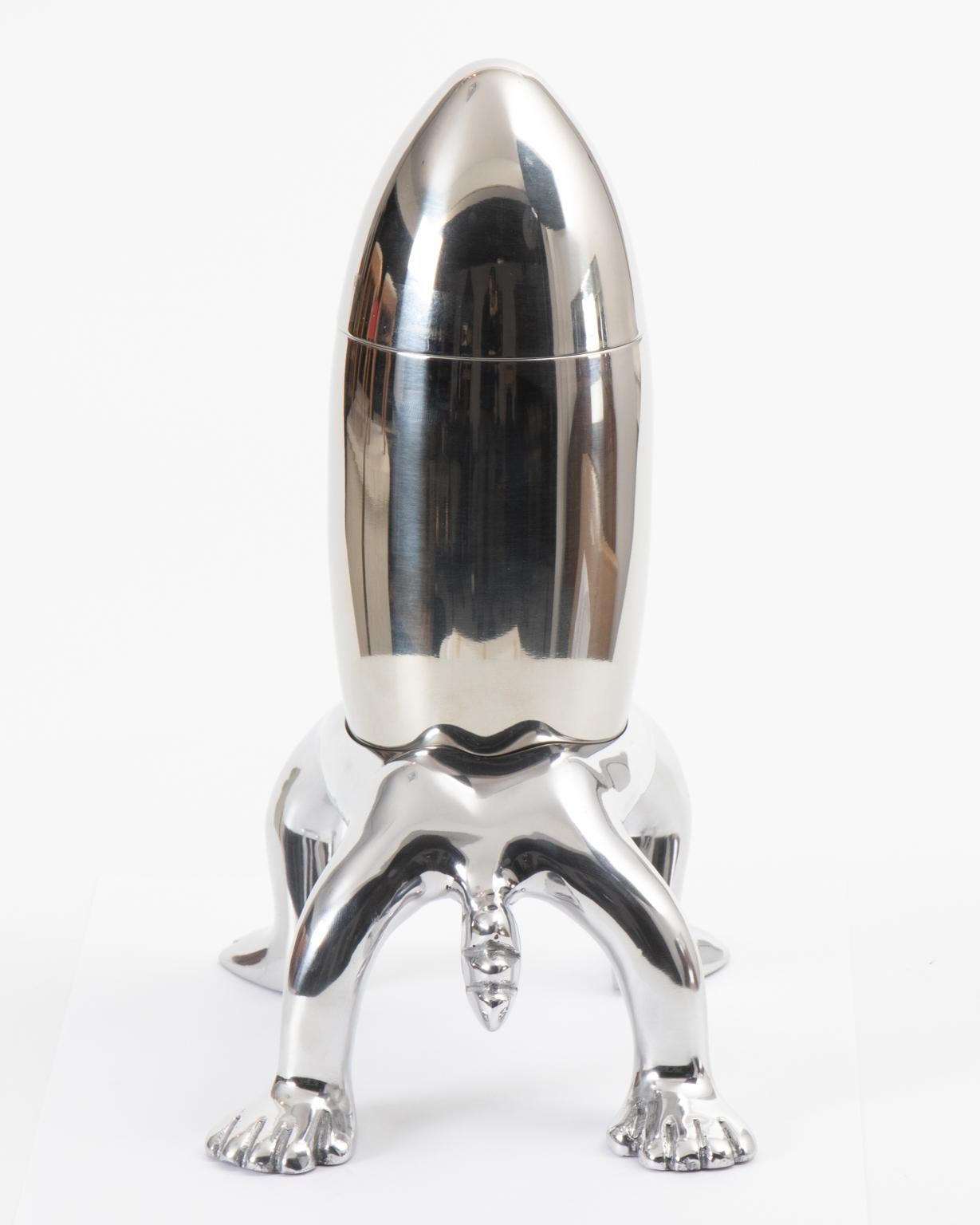 Handmade stainless steel cocktail shaker with aluminum base crafted by South African sculptor Carrol Boyes, circa 2000. Please note of wear consistent with age. The piece features a polished finish.