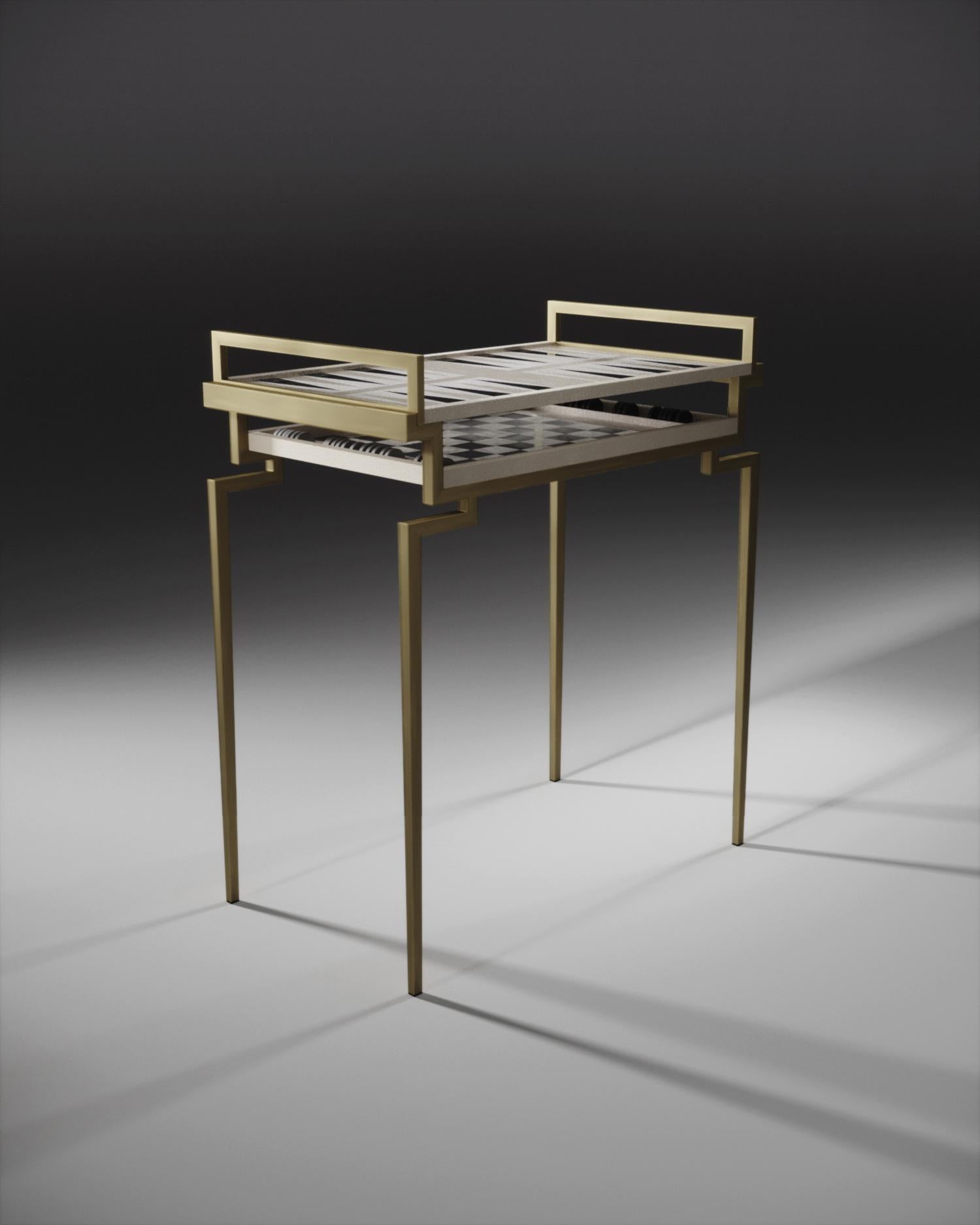 The Cecelia game table by R&Y Augousti inlaid in a mixture of cream shagreen, black pen shell and brass is the ultimate luxury piece of furniture. The top tabletop tray is for backgammon and the bottom tabletop tray is for chess. Each tabletop tray