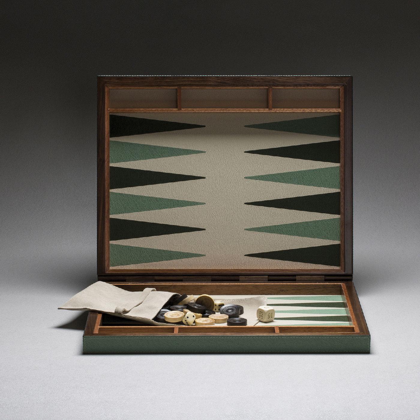 This elegant small backgammon case is made entirely in walnut wood and mahogany and uses walnut wood hinges. The playing surface is in inlaid leather and the color combination of the board can be customized. Checkers in boxwood and dice are
