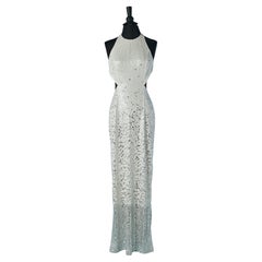 Backless evening dress in silver and white sequin Caché