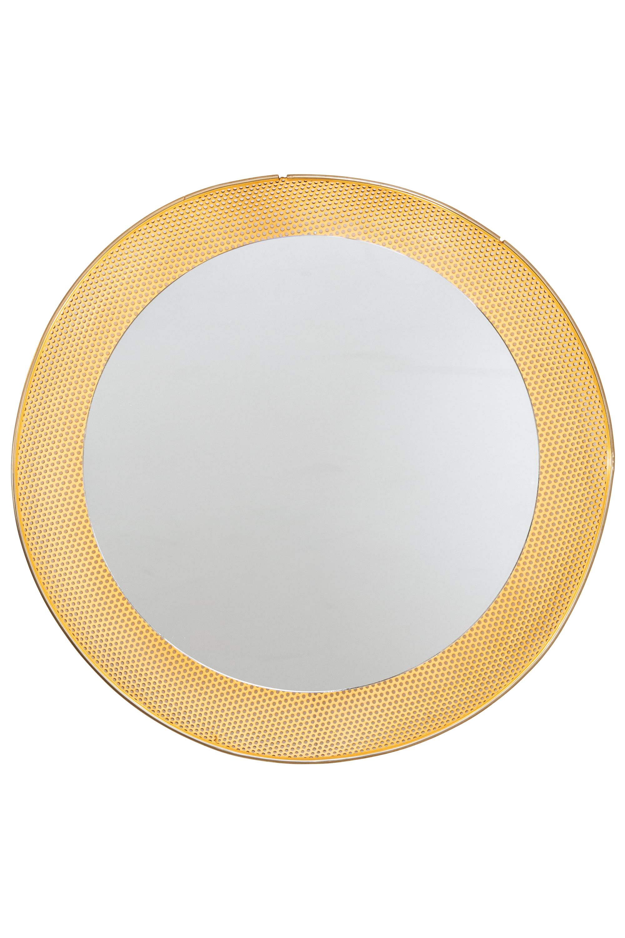 This mirror has a perforated metal frame very much in the style of Mathieu Matégot.
