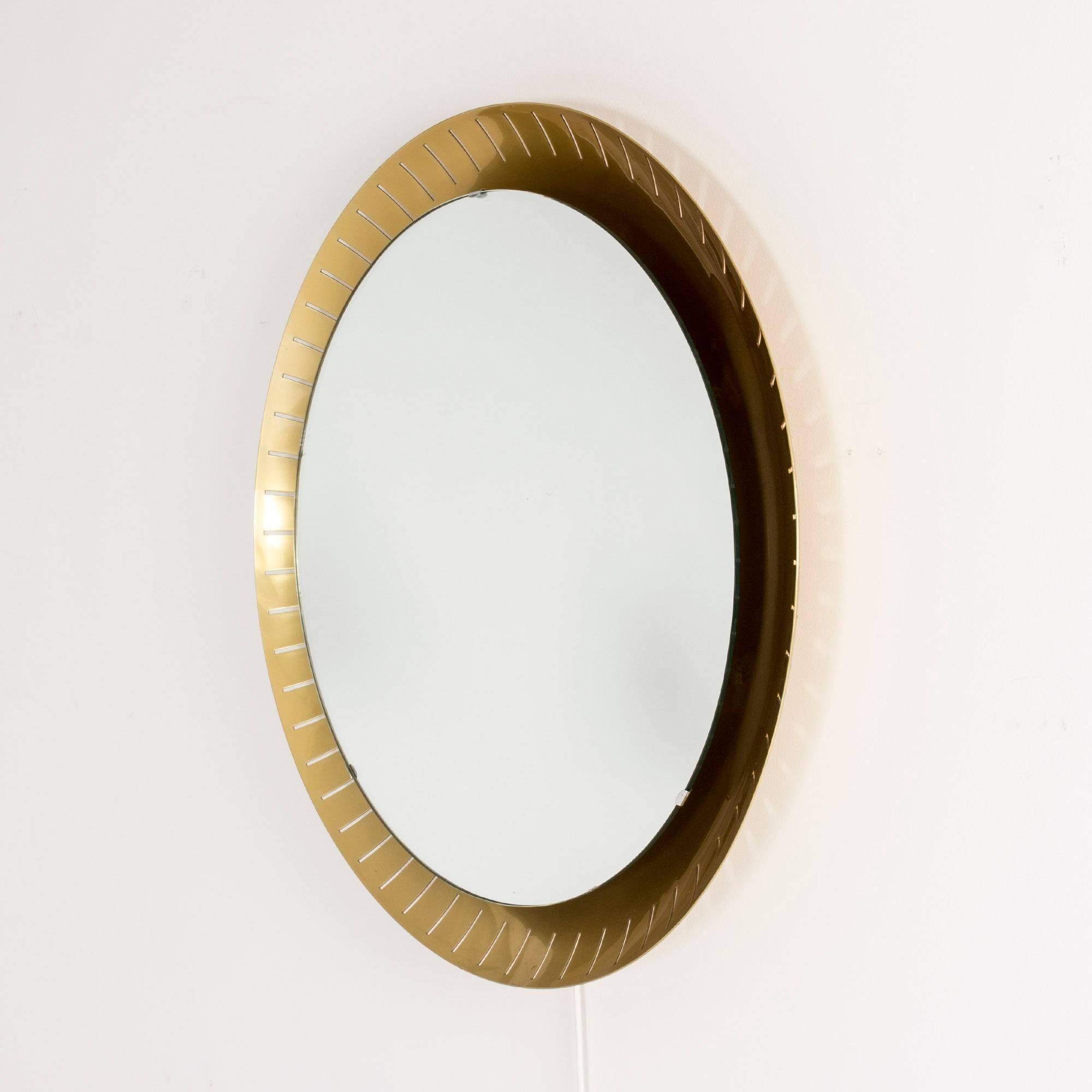 Beautiful round backlit wall mirror from Stilnovo, stylish and with a great atmosphere with its soft light coming from behind the mirror. Frame gold lacquered on the inside
