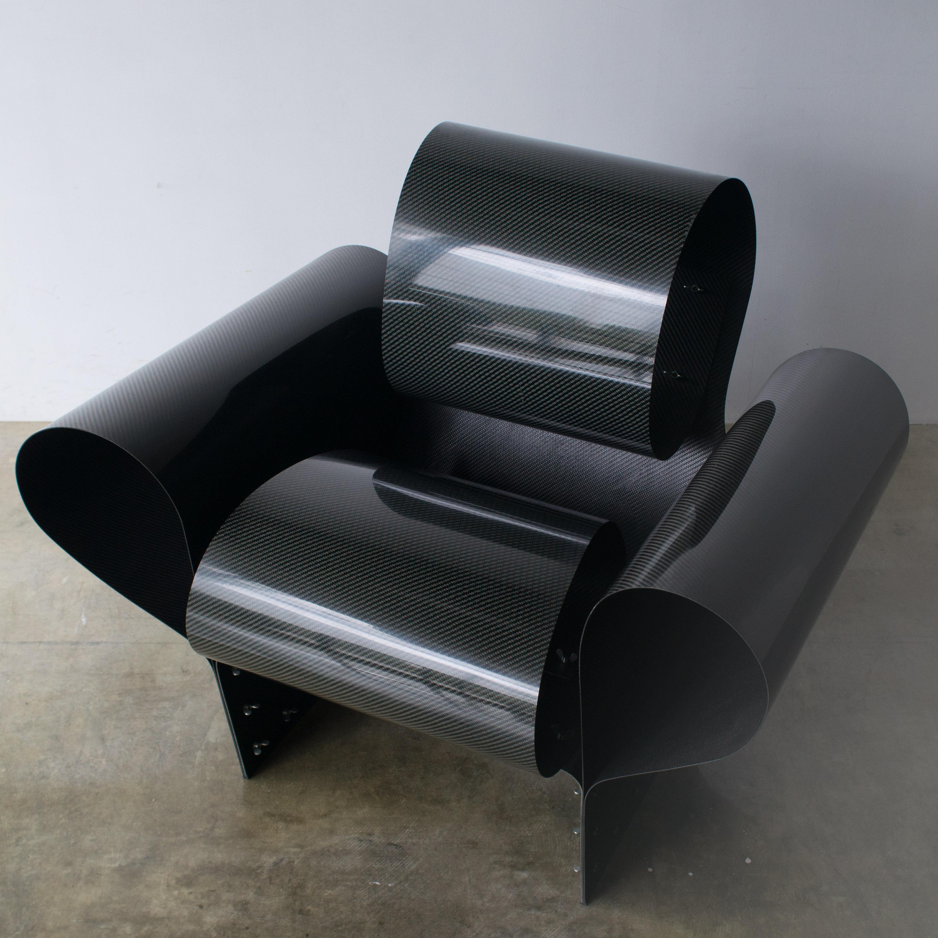 Bad tempered chair designed by Ron Arad.
Lounge chair made of curved carbon fiber board. Limited edition 39/1000
Vitra quit producing it in 2009. Produced numbers until that time were less than 200. 

      