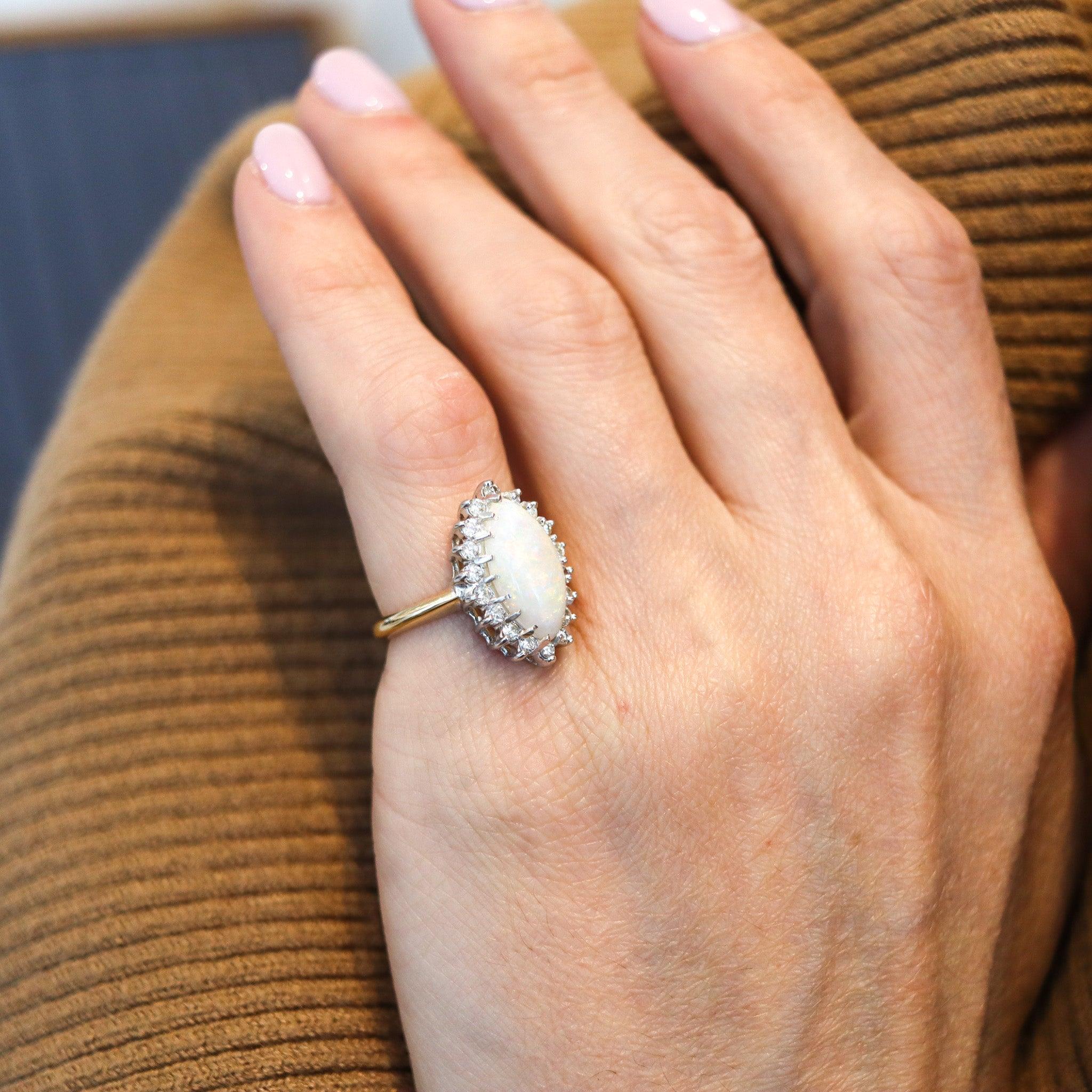 A cocktail ring designed by Baden & Foss.

Beautiful cocktail ring created in New York City by Baden & Foss during the post war period, back in 1950. This ring was crafted in solid yellow and white gold of 14 karats with high polished finish and