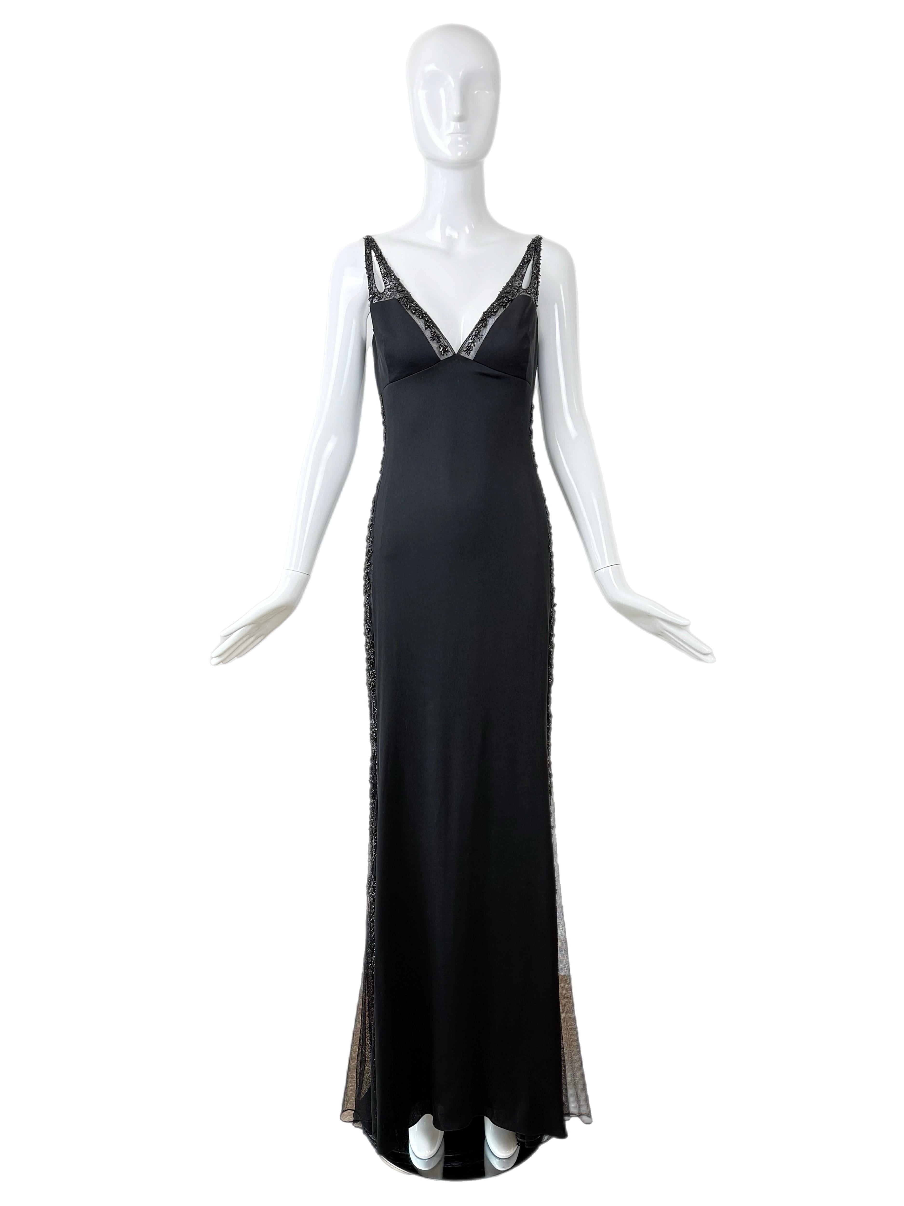 Badgley Mischka
Vintage
1990's
Seta nera con cristalli tono su tono
Semi-velato
Manca l'etichetta della taglia, vedi le misure sotto.
Ottime condizioni, piccoli segni d'usura
Misure in pollici in piano: lunghezza escluso lo strascico 60, da fossa a