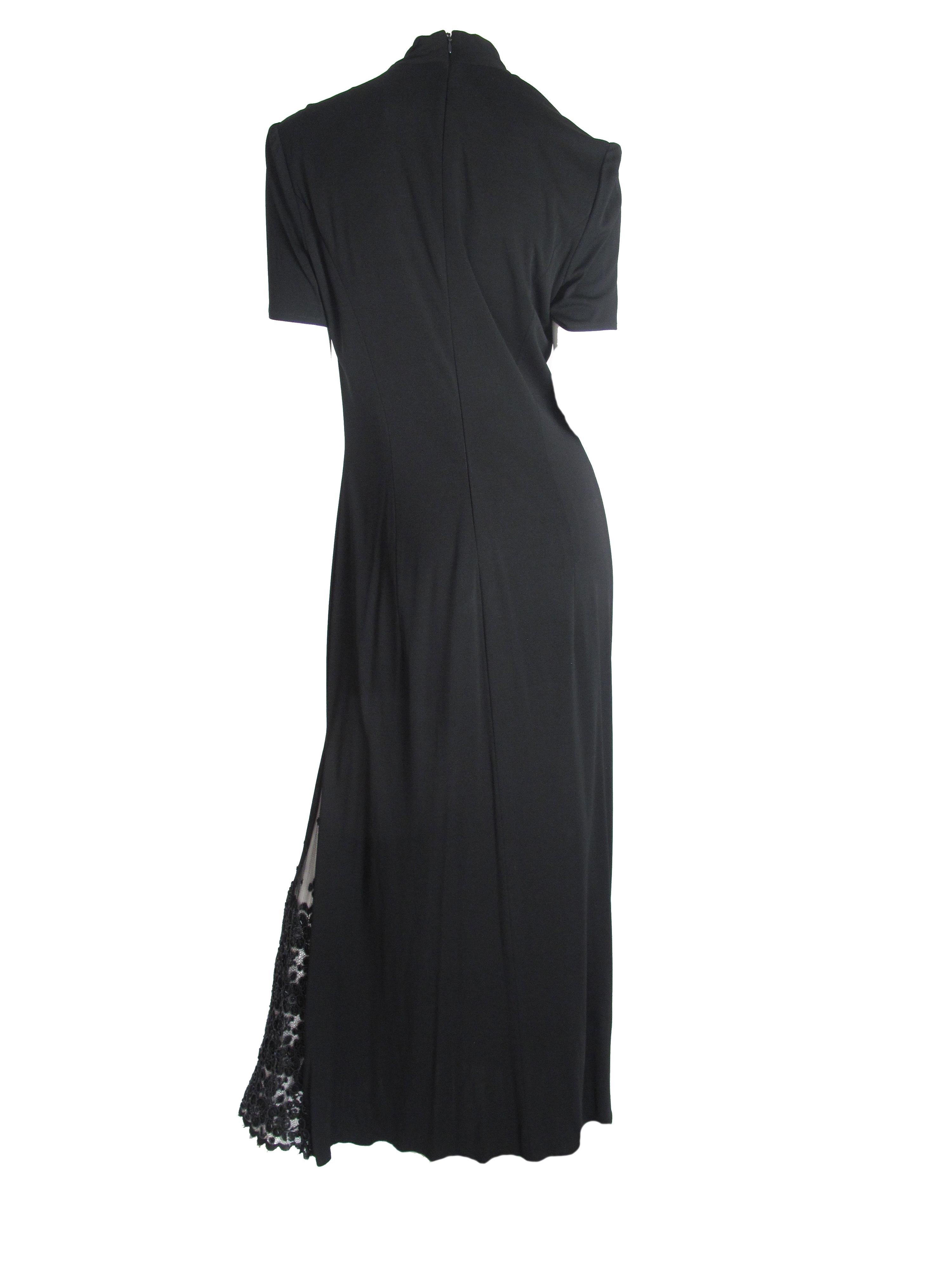 Badgley Mischka black evening gown with lace insert. Condition: Excellent. Size 10