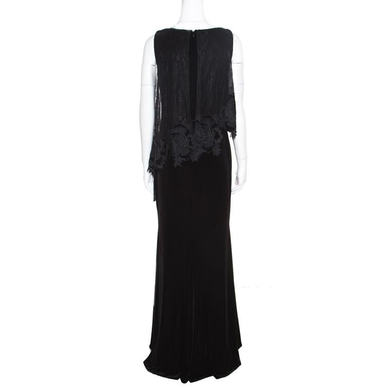 An apt choice for black-tie events and cocktail parties, this Badgley Mischka Popover gown features a classic black velvet body accented beautifully with a floral lacework on the bodice that gives the piece a high-fashion look. Finished with a