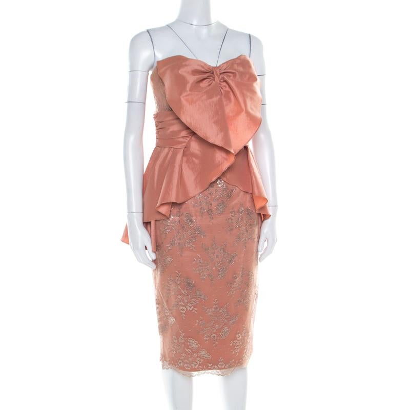 This strapless kimono dress from Badgley Mischka Collection is sure to hearts racing! The copper creation is made of a blend of fabrics and features a flattering feminine silhouette. It flaunts an elegant overlay of floral lace and draped details on