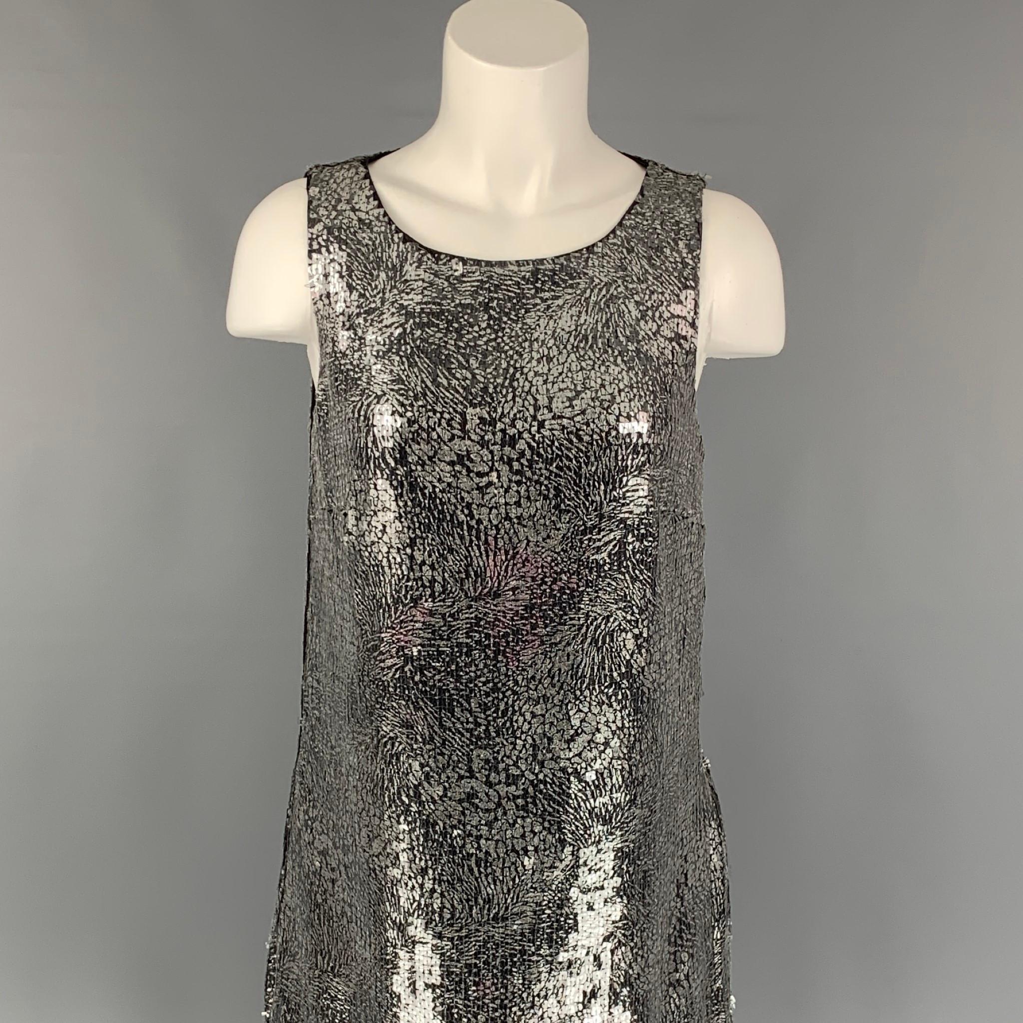 BADGLEY MISCHKA COLLECTION dress comes in a silver & black sequined polyester featuring a shift style, ostrich feather trim, sleeveless, and a side zipper closure. 

Very Good Pre-Owned Condition. Fabric tag removed. Light discoloration at