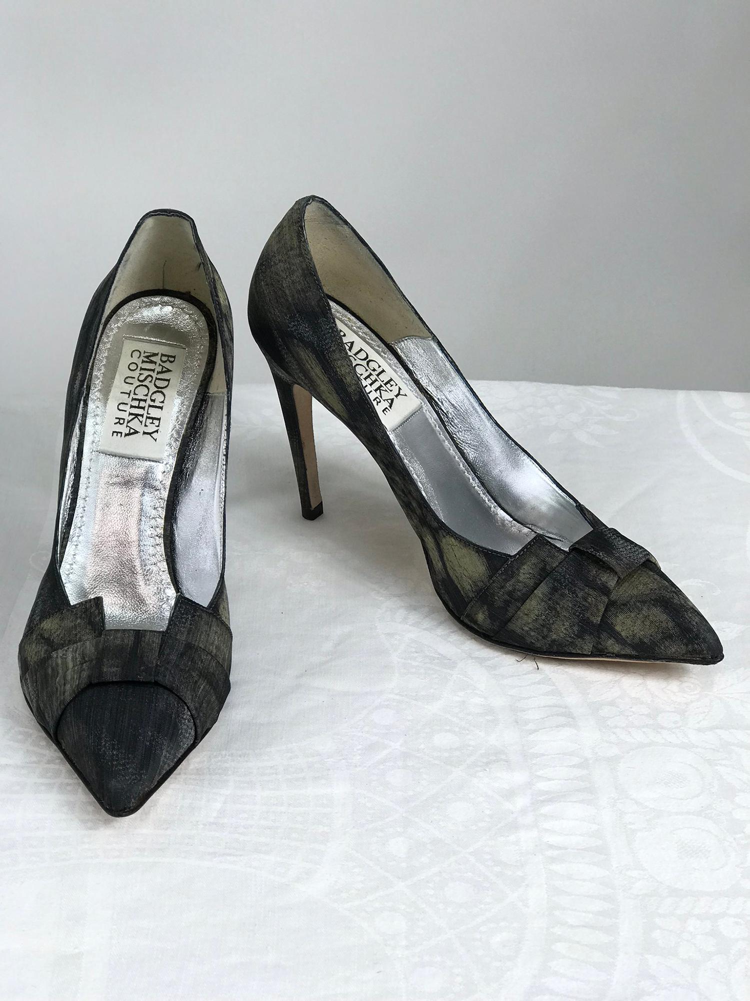 Badgley Mischka Couture black sunflower fabric high heel pumps 6 1/2.  4 inch heels.
Shaped bow front vamp, pointed toe pump in silky textured fabric in shades of black, grey, brown. With box and protector bag. Look barely worn. 