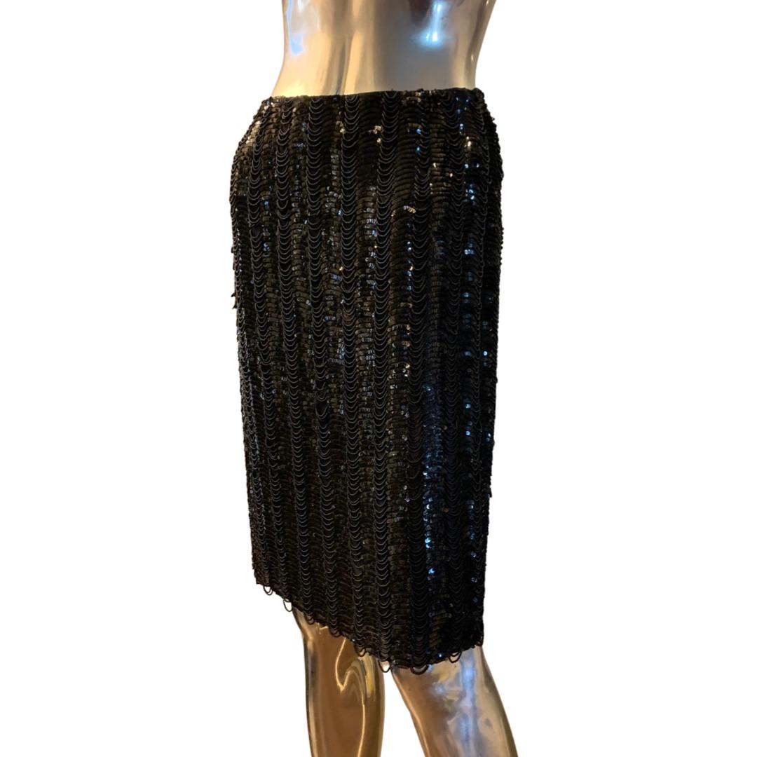 This skirt is a work of art, completely hand beaded with tiniest of beads swagged in between black sequins on the entire skirt! the skirt was custom ordered by a Fashionista in NYC, and made by hand, couture style in USA by Badgely Mischka . 100%
