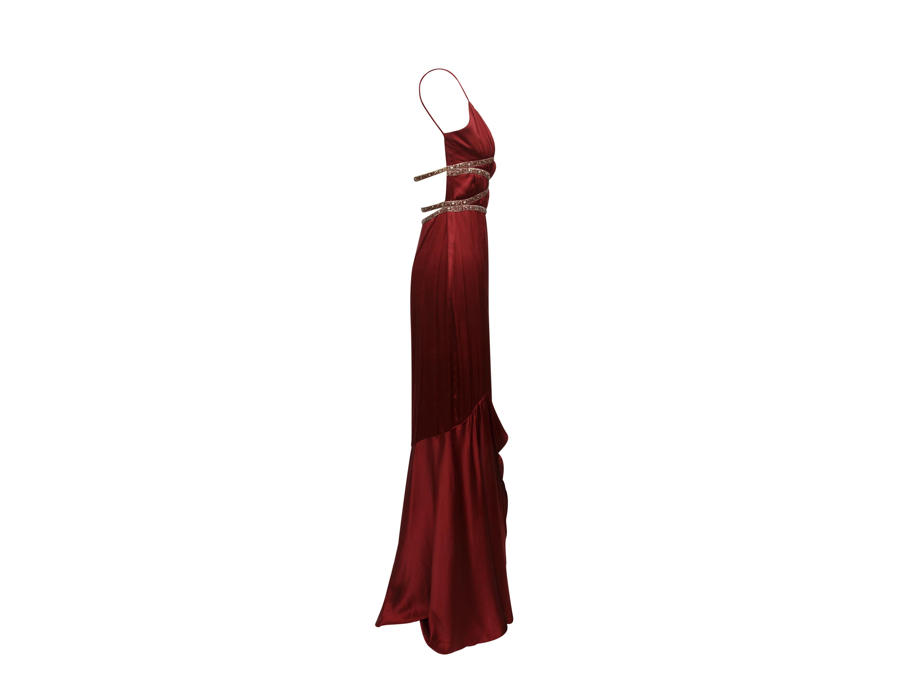 Product details:  Burgundy silk beaded bodice gown by Badgley Mischka.  Edie Falco's 2003 SAG Awards dress.  V-neck.  Sleeveless.  Ruffles cascade at side.  Concealed closure.  28