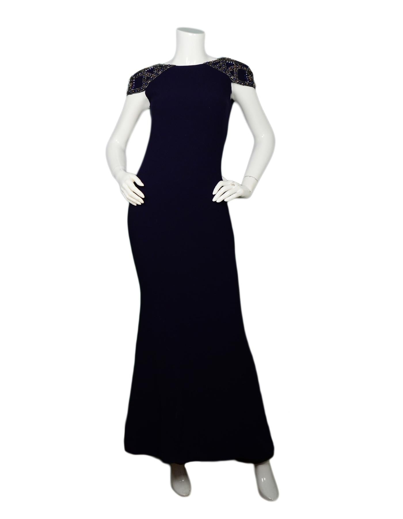 Badgley Mischka Navy Gown W/ Embellished Capsleeves Sz 0

Made In: China
Color: Navy
Materials: 100% polyester
Lining: 100% polyester
Opening/Closure: Hidden back zip with hook eye at top
Overall Condition: Excellent pre-owned condition 

Marked