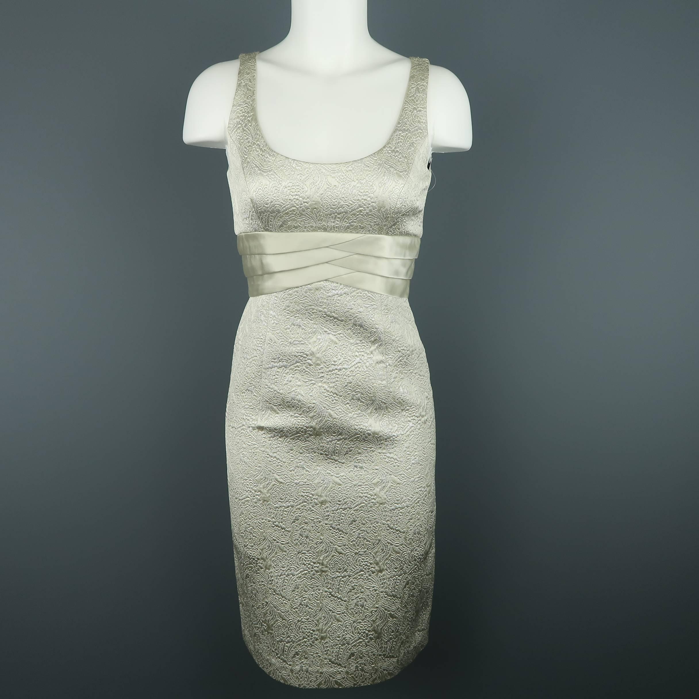 BADGLEY MISCHKA look comes in a metallic silver lace brocade fabric and includes a sleeveless sheath dress with pleated underbust detail and matching high neck bolero.
 
Excellent Pre-Owned Condition.
Marked: 0
 
Measurements:
 
Dress:
Shoulder: 12