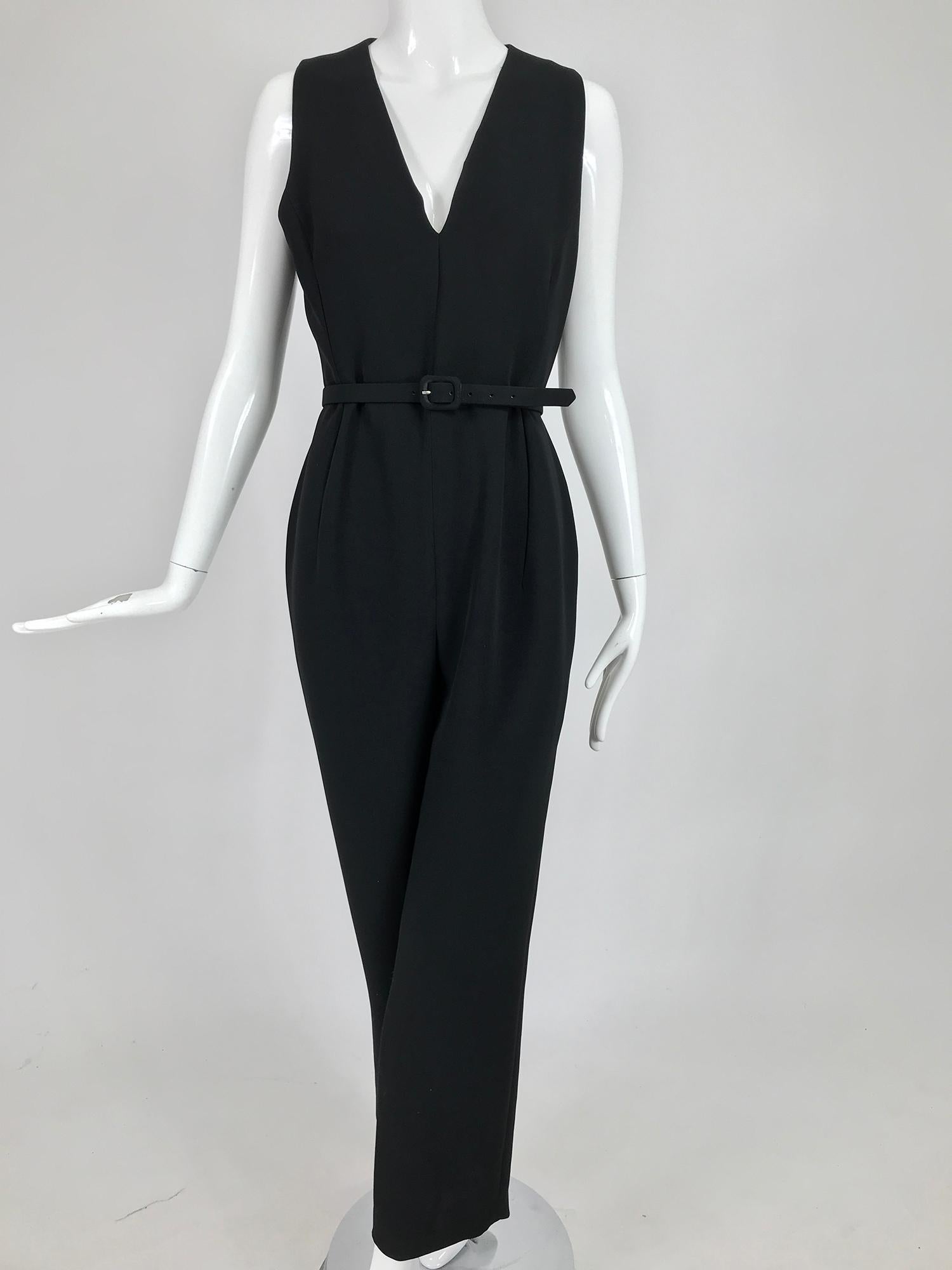 Badgley Mischka black tuxedo coat and matching jumpsuit each marked size 6.  This beautiful 2pc set can be worn as a chic outfit that is perfect for any occasion that requires you to look amazing, or worn as separates. 
The coat closes at the front