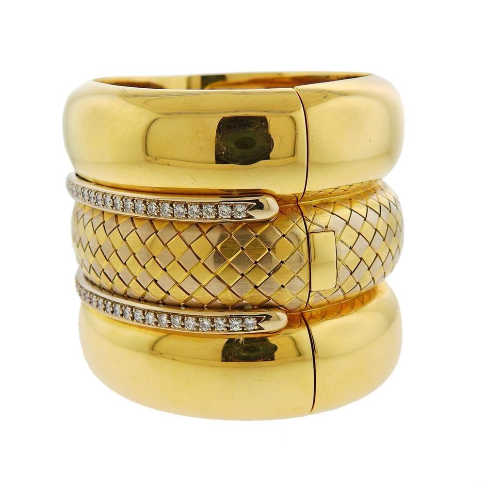 Massive 18k gold bangle bracelet by Italian designer Badler. Bracelet will fit up to a 7