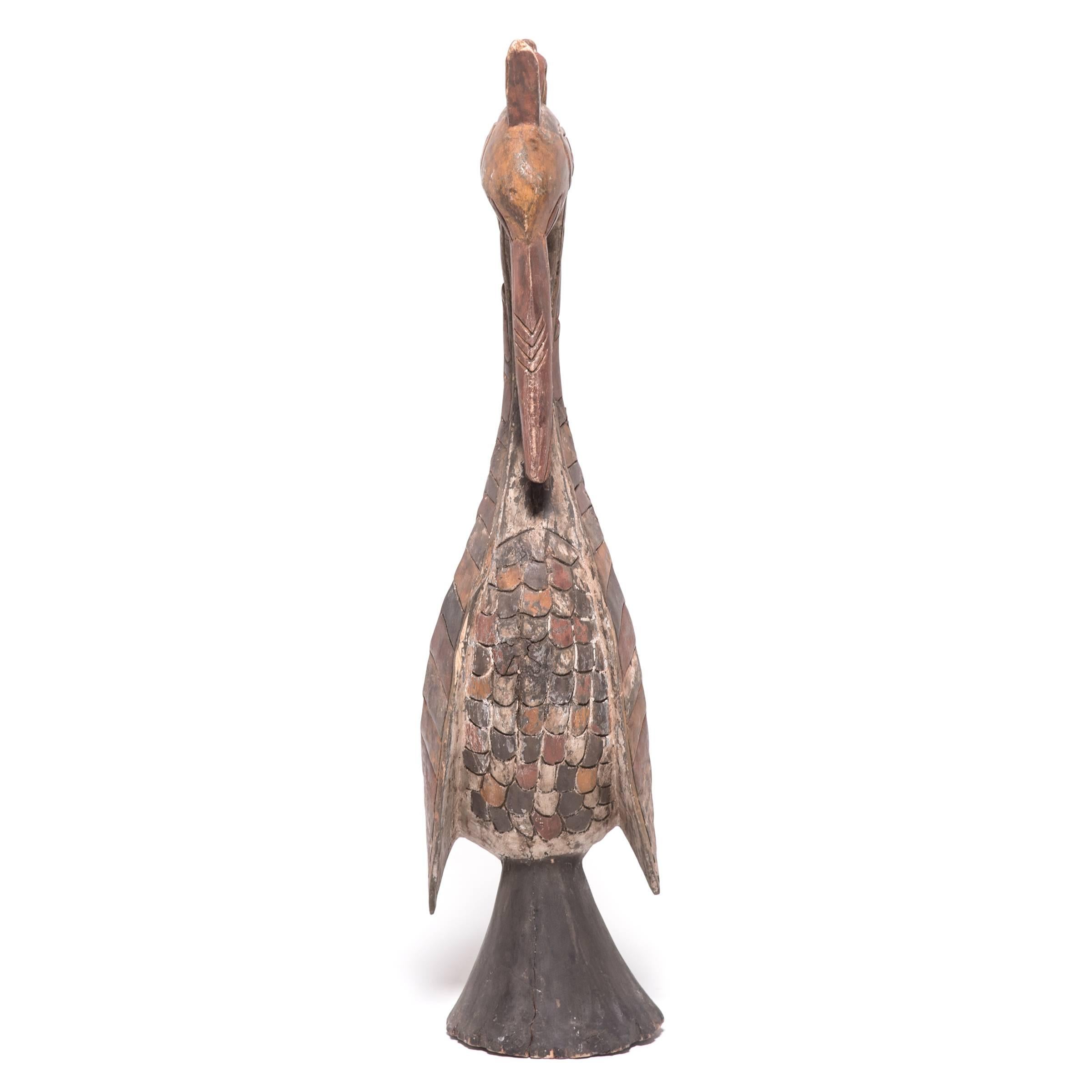 The Baga believed birds to be powerful protectors of the harvest and wards against witchcraft. Every home featured one of these honored sculptures. The bird's posture, gaze, and hand-carved plumage exude a sense of strength and dignity. The