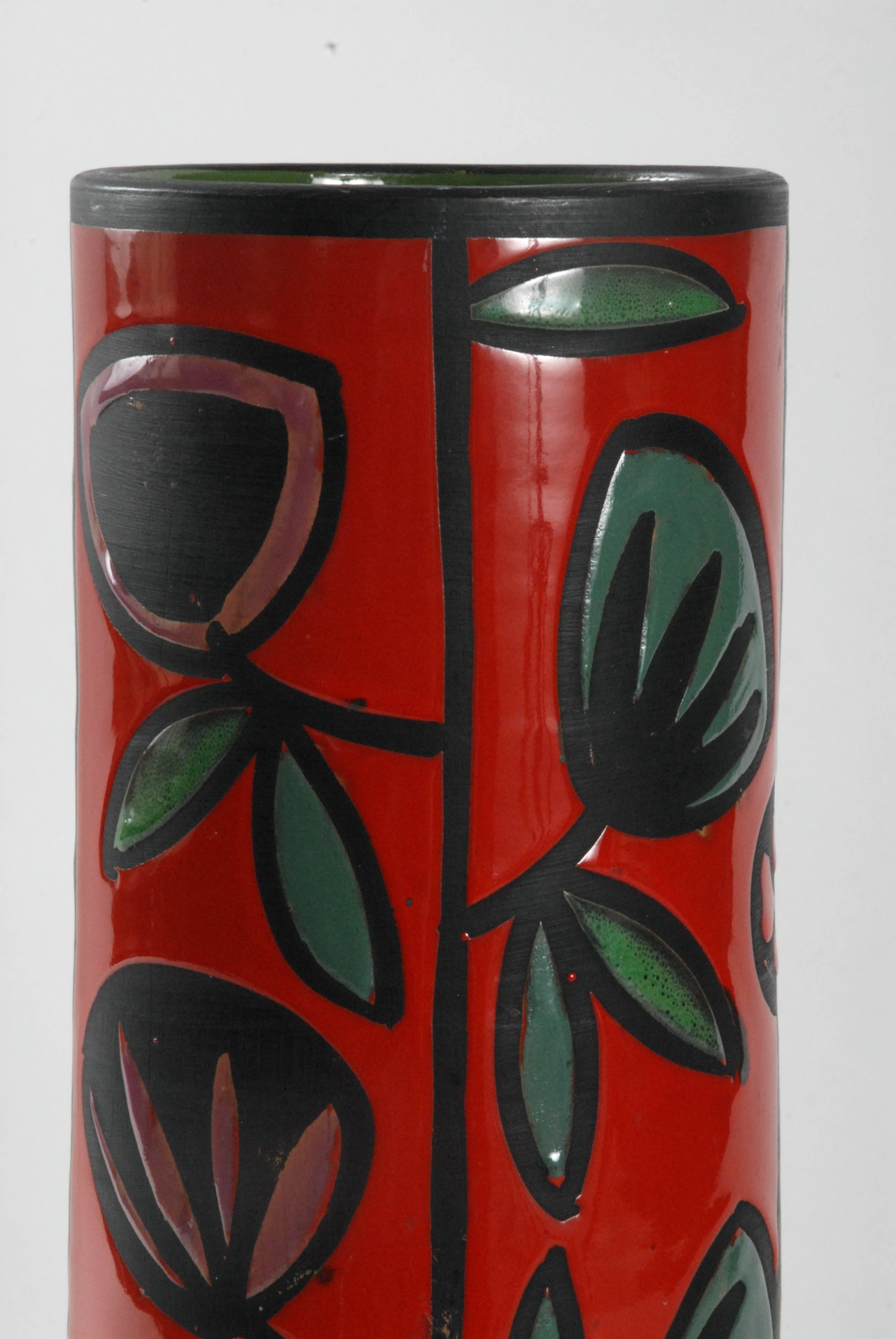 A large cylinder vase designed by Alvino Bagni with green and red vertical panels decorated with a wax-resist pattern of flowers and leaves in excellent condition.