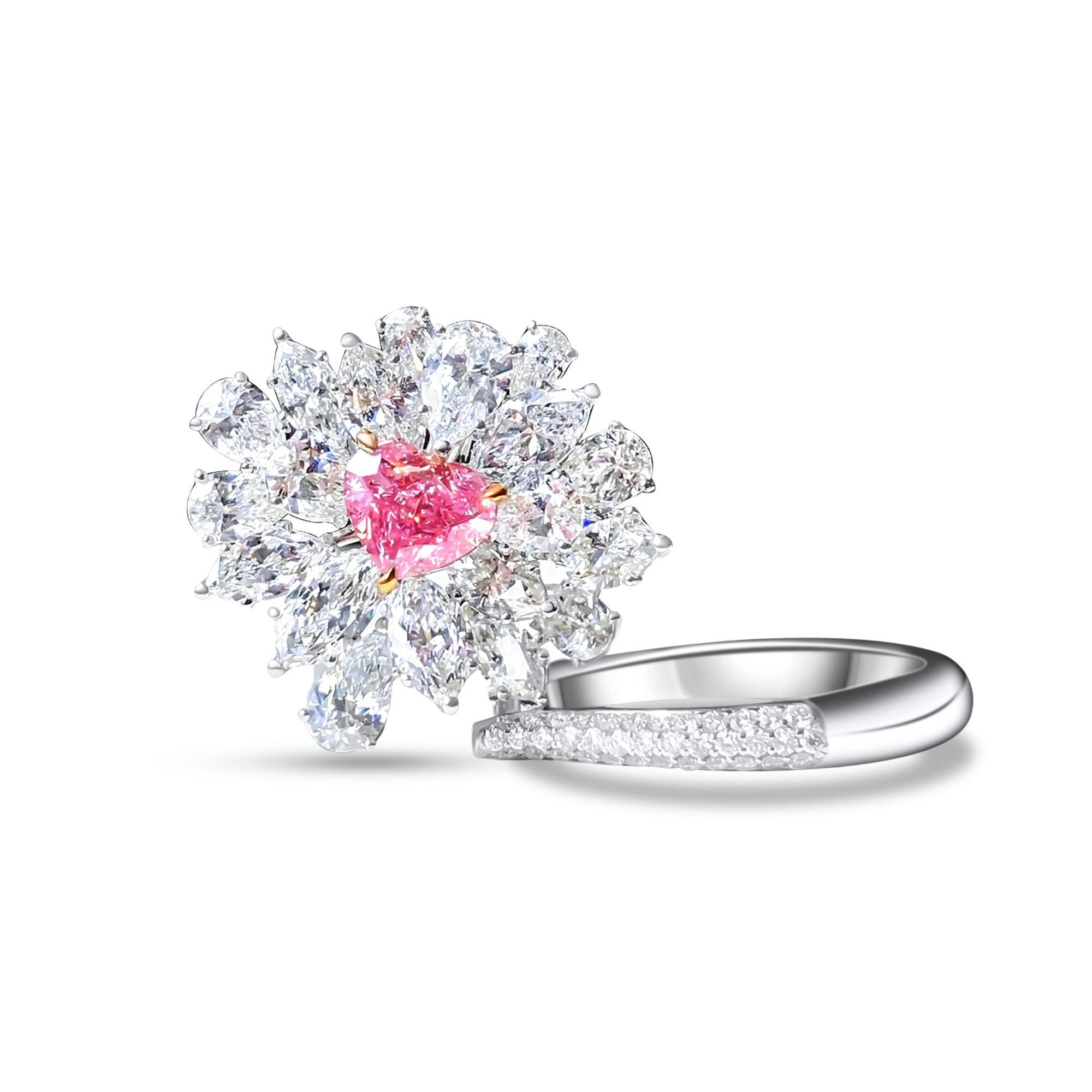 We invite you to discover this elegant ring set with a GIA certified heart-cut pink diamond of 1.01 carats accented with pear-cut colorless diamonds of 4 carats in total. Versatile, it can also be worn as a magnificent pendant 

New ring 
Main