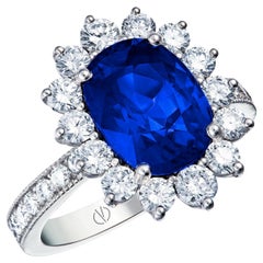 18k White Gold 3.99 Carat Royal Blue Oval Sapphire Ring With 1 Cts of Diamonds