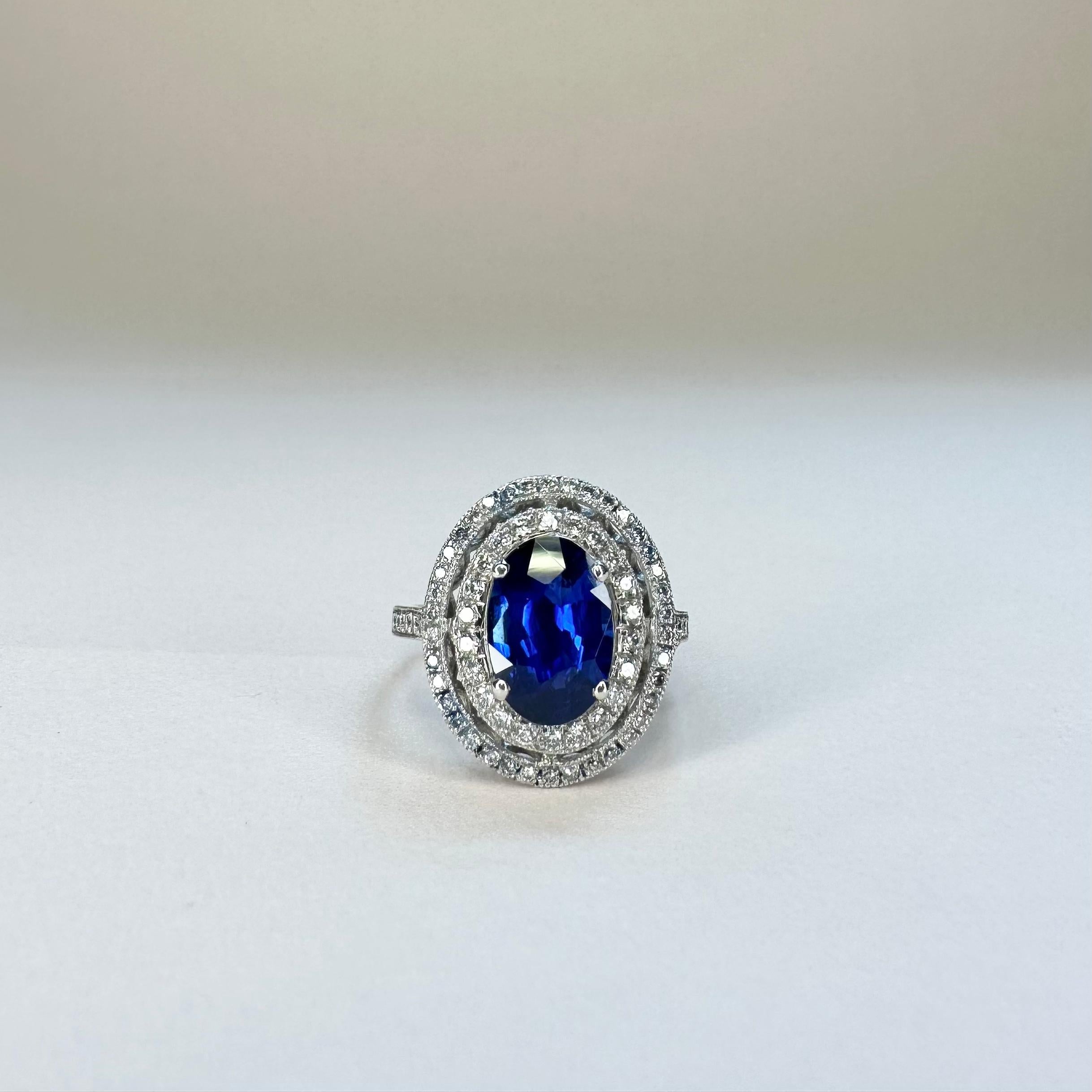 For Sale:  18k White Gold 2.74 Ct Royal Blue Oval Sapphire Ring With Two Rows of Diamonds 4
