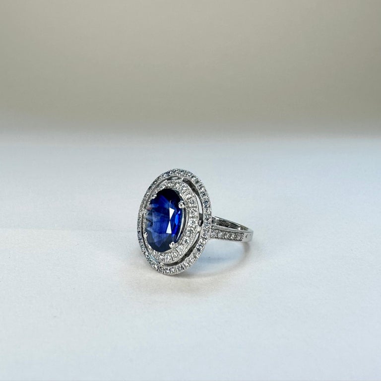 For Sale:  18k White Gold 2.74 Ct Royal Blue Oval Sapphire Ring With Two Rows of Diamonds 5