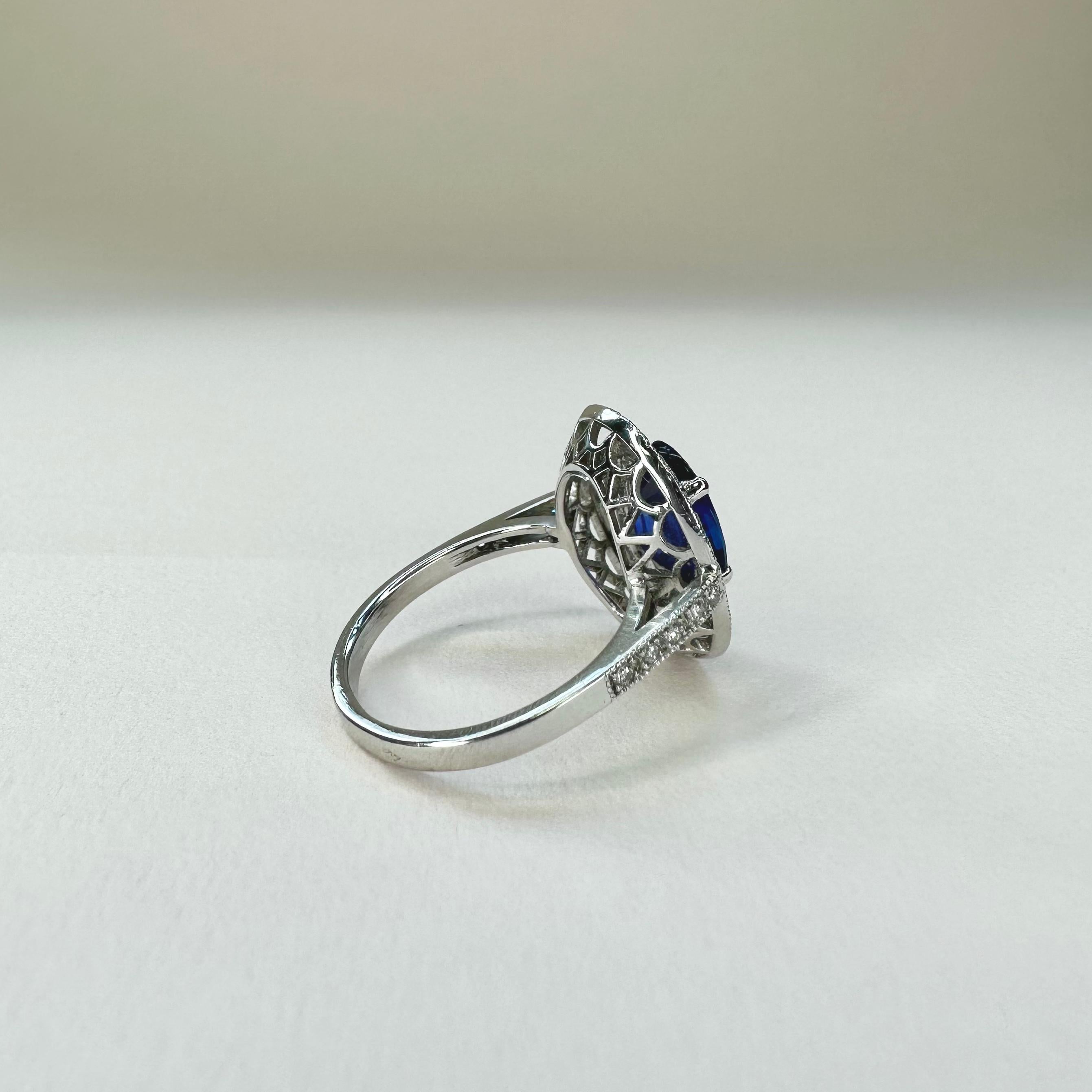 For Sale:  18k White Gold 2.74 Ct Royal Blue Oval Sapphire Ring With Two Rows of Diamonds 6