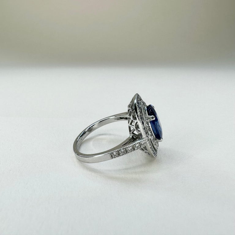 For Sale:  18k White Gold 2.74 Ct Royal Blue Oval Sapphire Ring With Two Rows of Diamonds 7