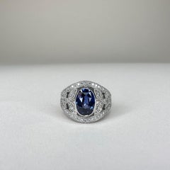 18k White Gold Band Ring 3 Ct Royal Blue Oval Sapphire and 0.60 Cts of Diamonds