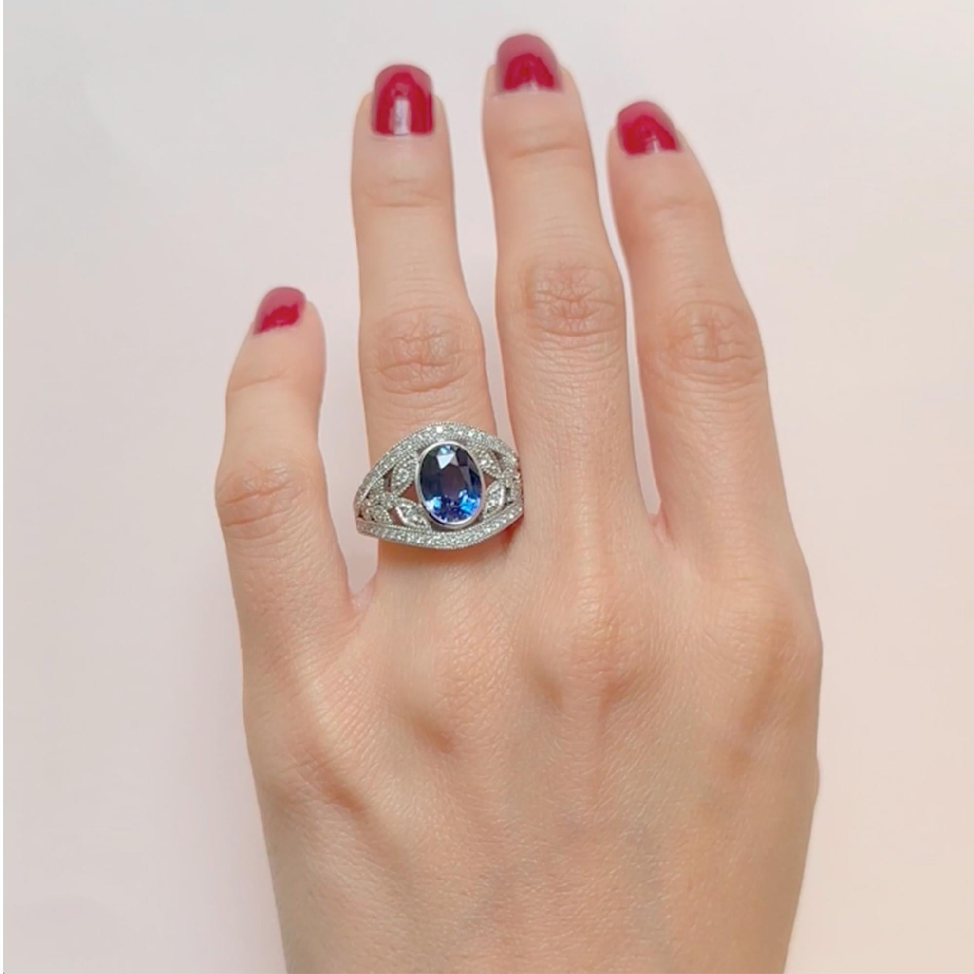 For Sale:  18k White Gold Band Ring 3 Ct Royal Blue Oval Sapphire and 0.60 Cts of Diamonds 6