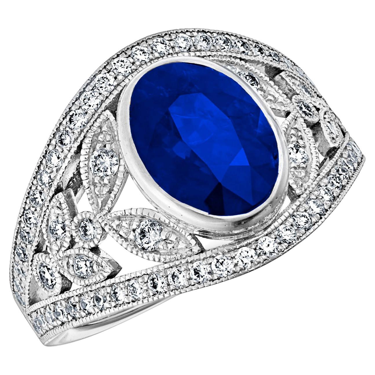 18k White Gold Band Ring 3 Ct Royal Blue Oval Sapphire and 0.60 Cts of Diamonds