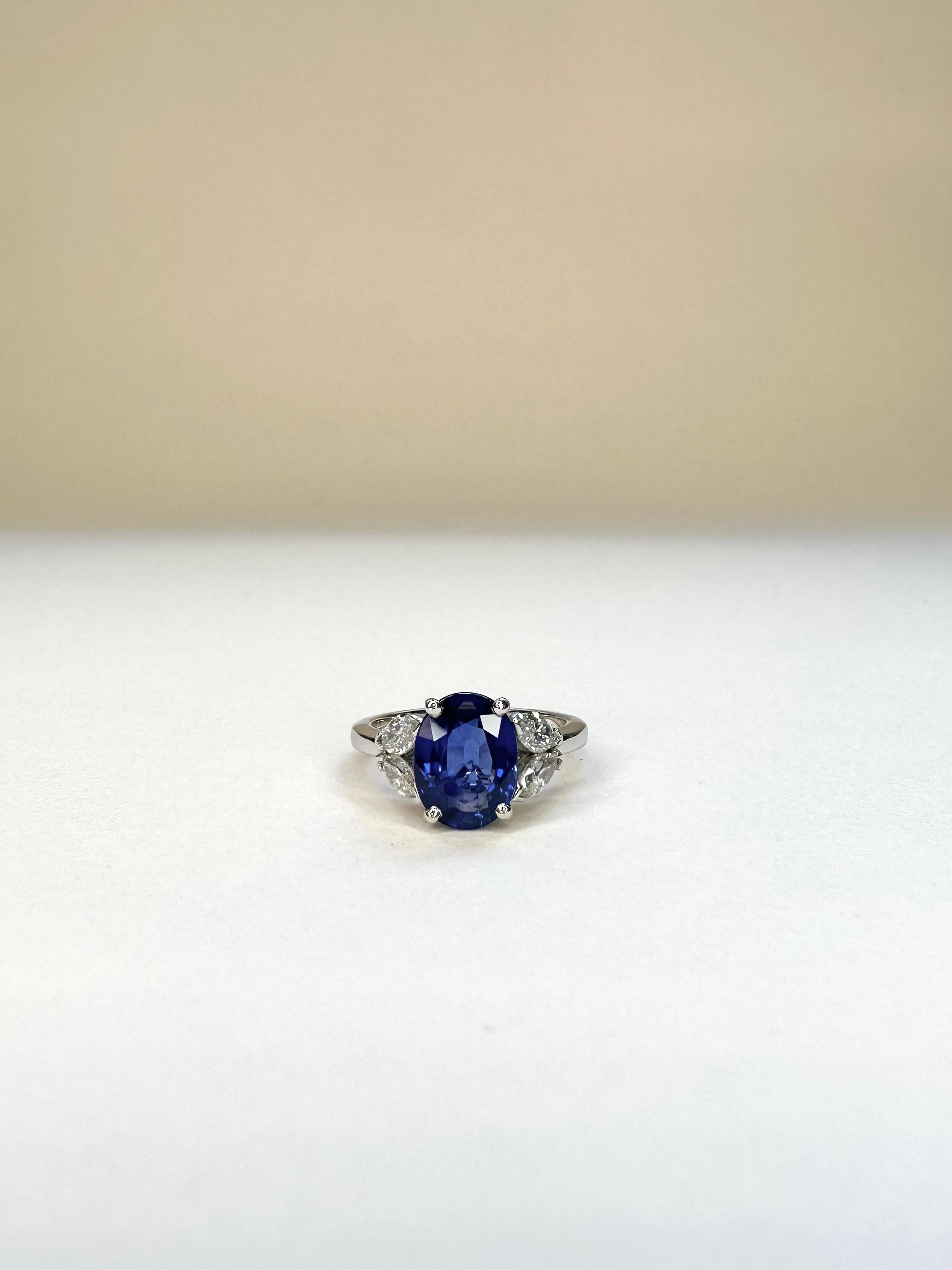 For Sale:  18k White Gold 2.83 Ct Royal Blue Oval Sapphire Ring Set With 4 Marquise Diamond 2