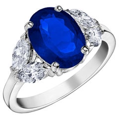 18k White Gold 2.83 Ct Royal Blue Oval Sapphire Ring Set With 4 Marquise Diamond