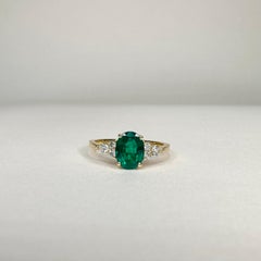 18k Yellow Gold 1, 18 Ct Oval Vivid Green Emerald and 0.28 Cts of Diamonds Ring
