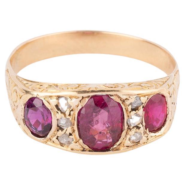 Bague jarretière ancienne en or, diamants et rubis