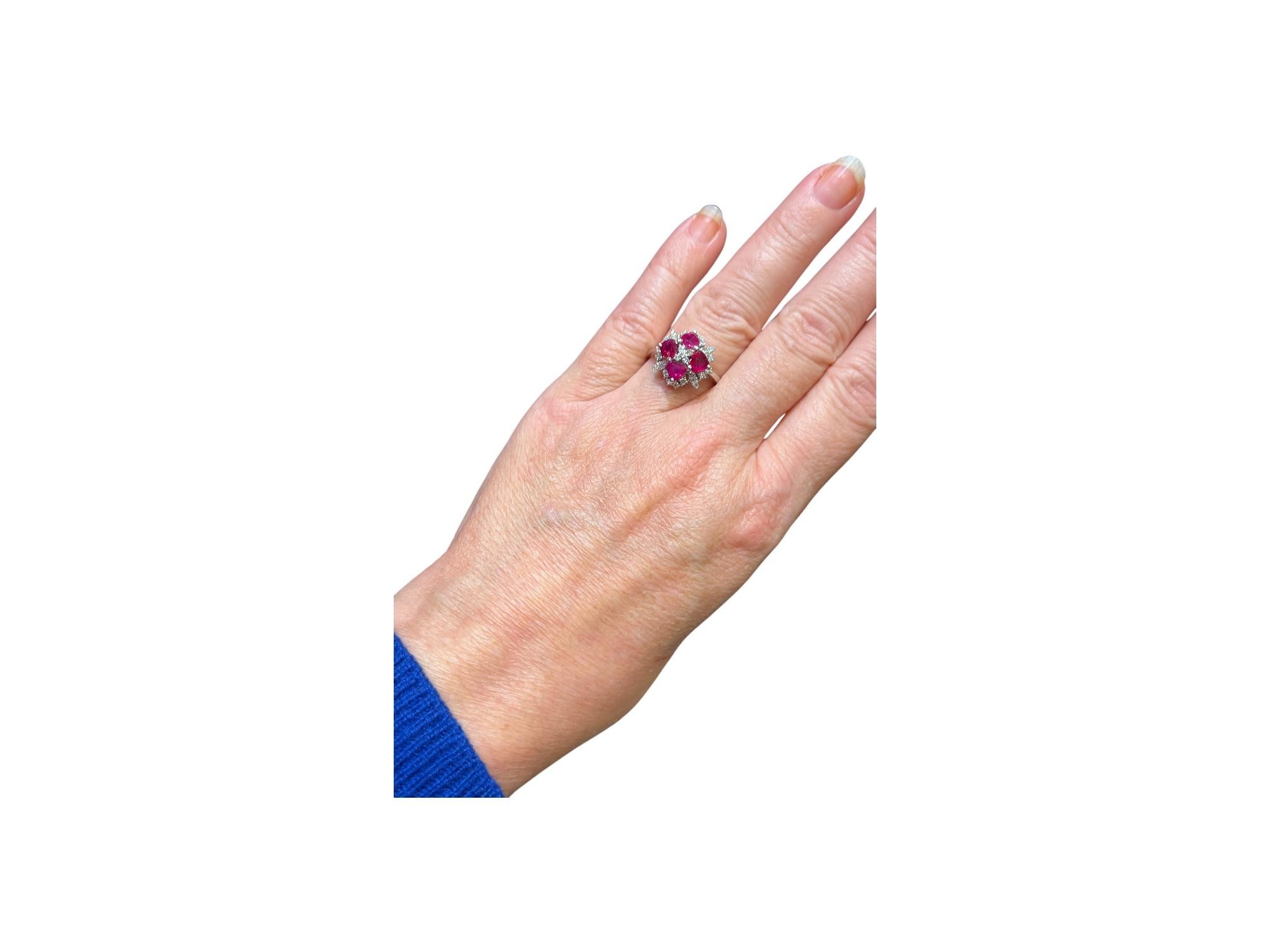 Luminous 18 carat white gold ring

Set with four rubies of very pretty sustained color,
 for about 2 carats, 
surrounded by a paving of sparkling diamonds for 0.50 carat for all.

This model is very original, 
it is rare to find heart-shaped