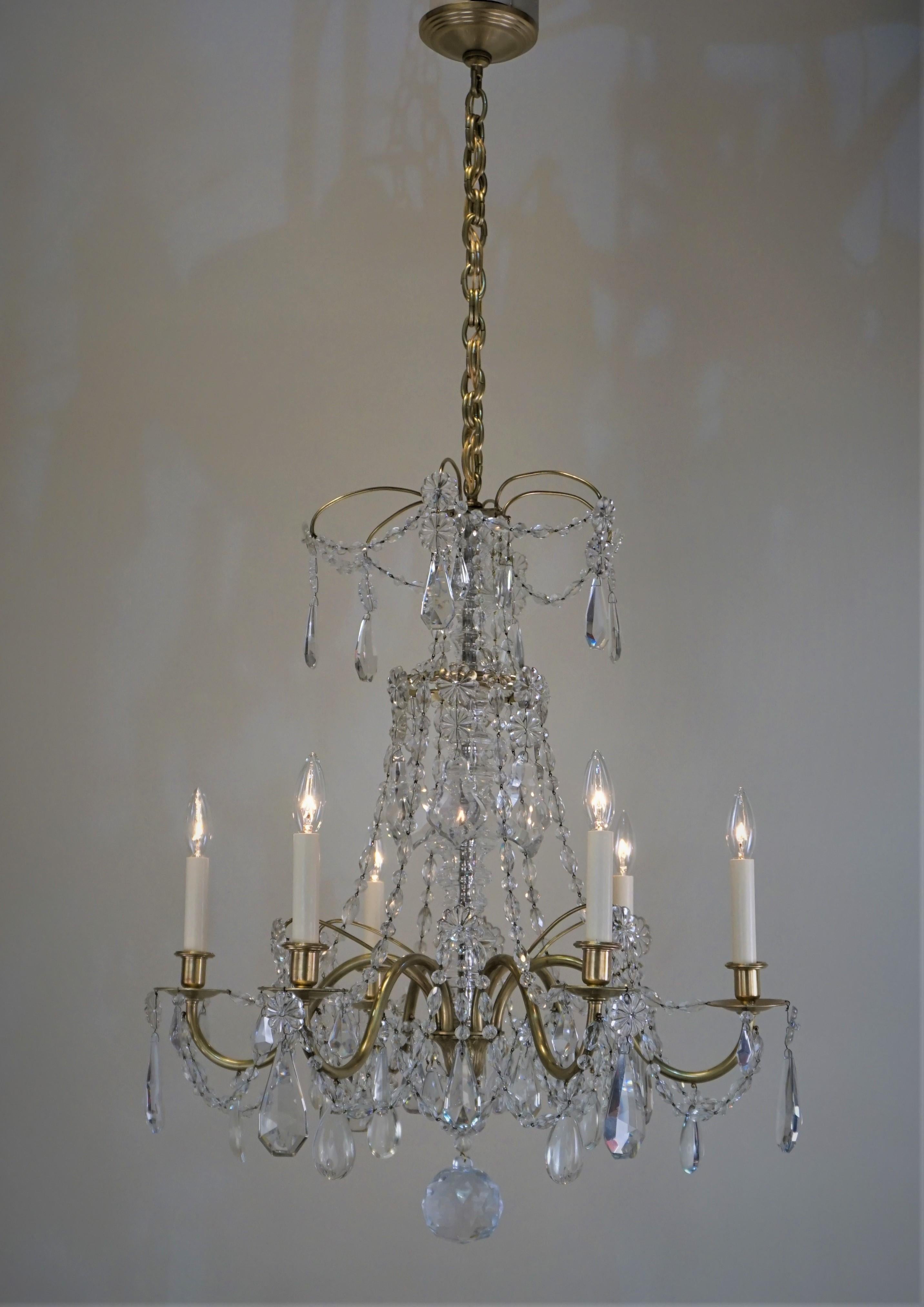 1920s six arm cut crystal and bronze chandelier by Maison Baguès. The elegant and detailed bronze frame, with heavy high quality cut crystals.
Minimum height fully installed is 36