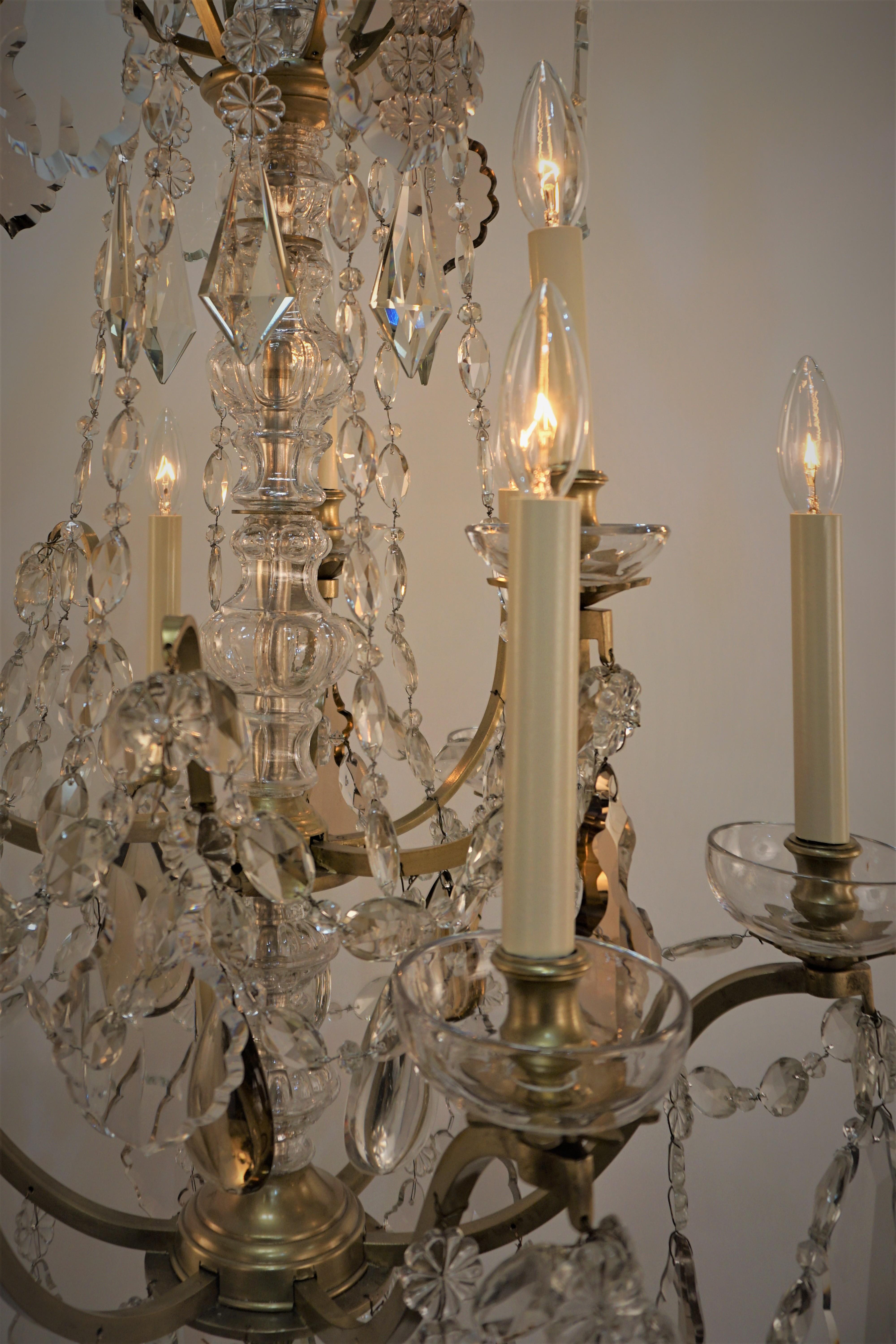 Fantastic nine light crystal and bronze chandelier, crafted in France in 1930s by famous lighting company Bagues. 
Professionally rewired and ready for installation.
Measurement: width 24