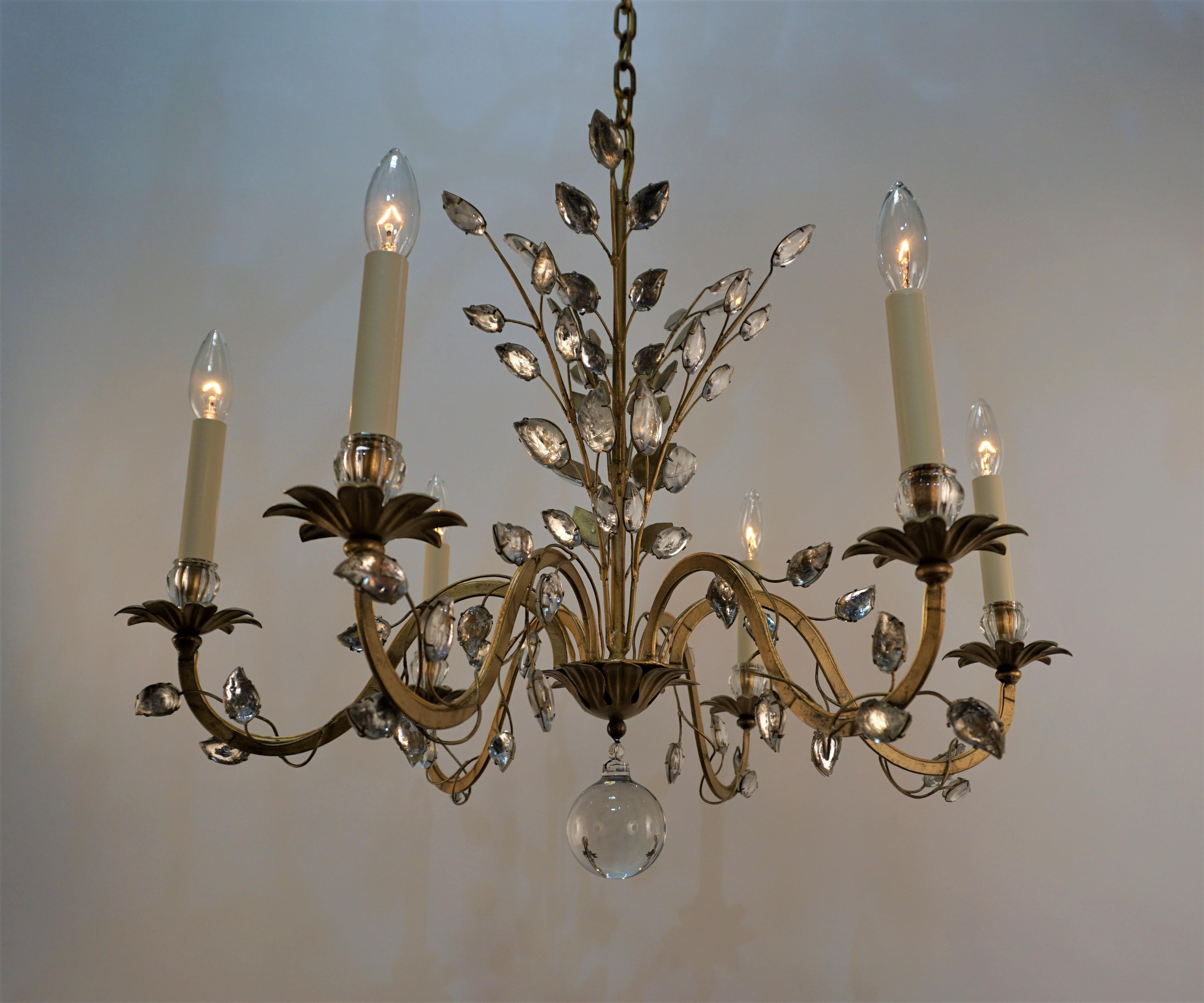 Elegant six arm gilt metal with delicate crystal leaf chandelier by Maison Bagues
Measurement: 27