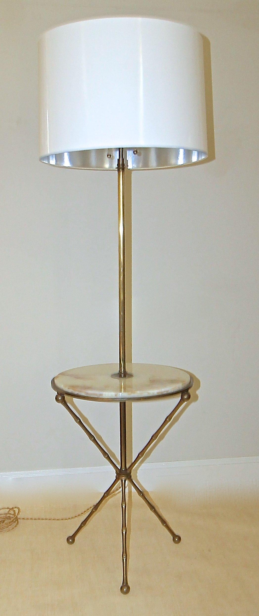 Beautiful and hard to find bronze faux bamboo lamp table with inset onyx top and tripod legs, attributed to Maison Bagues. Newly wired with brass double on/off pull sockets and French style rayon twisted cord. Shade not included and is shown for