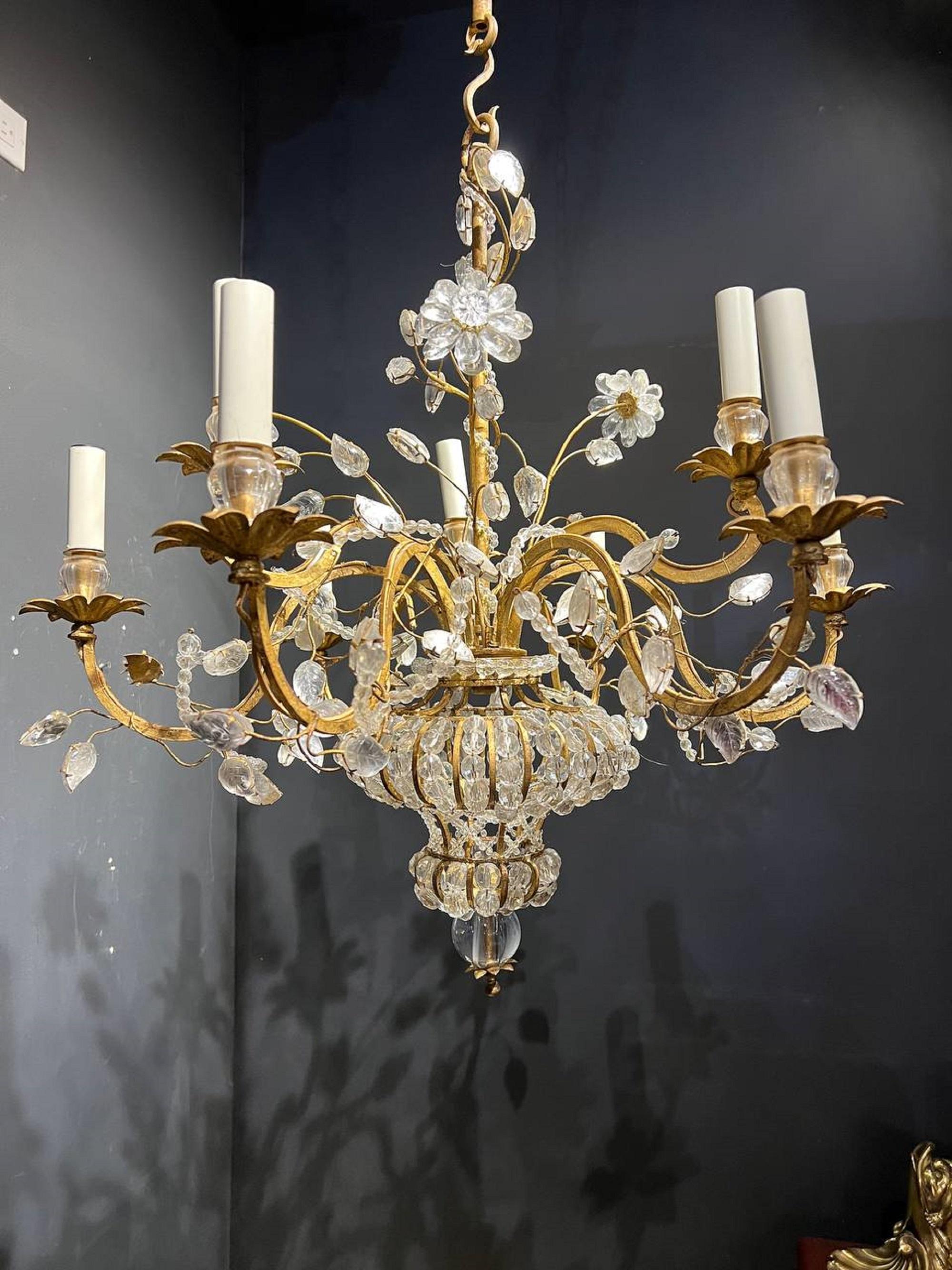 A circa 1930’s French Bagues 9 light chandelier with crystal flowers and leaves on the body. In very good vintage condition, newly rewired for the US. 

Up to 120V (US Standard)
Hardwired

Dealer: G302YP 
   