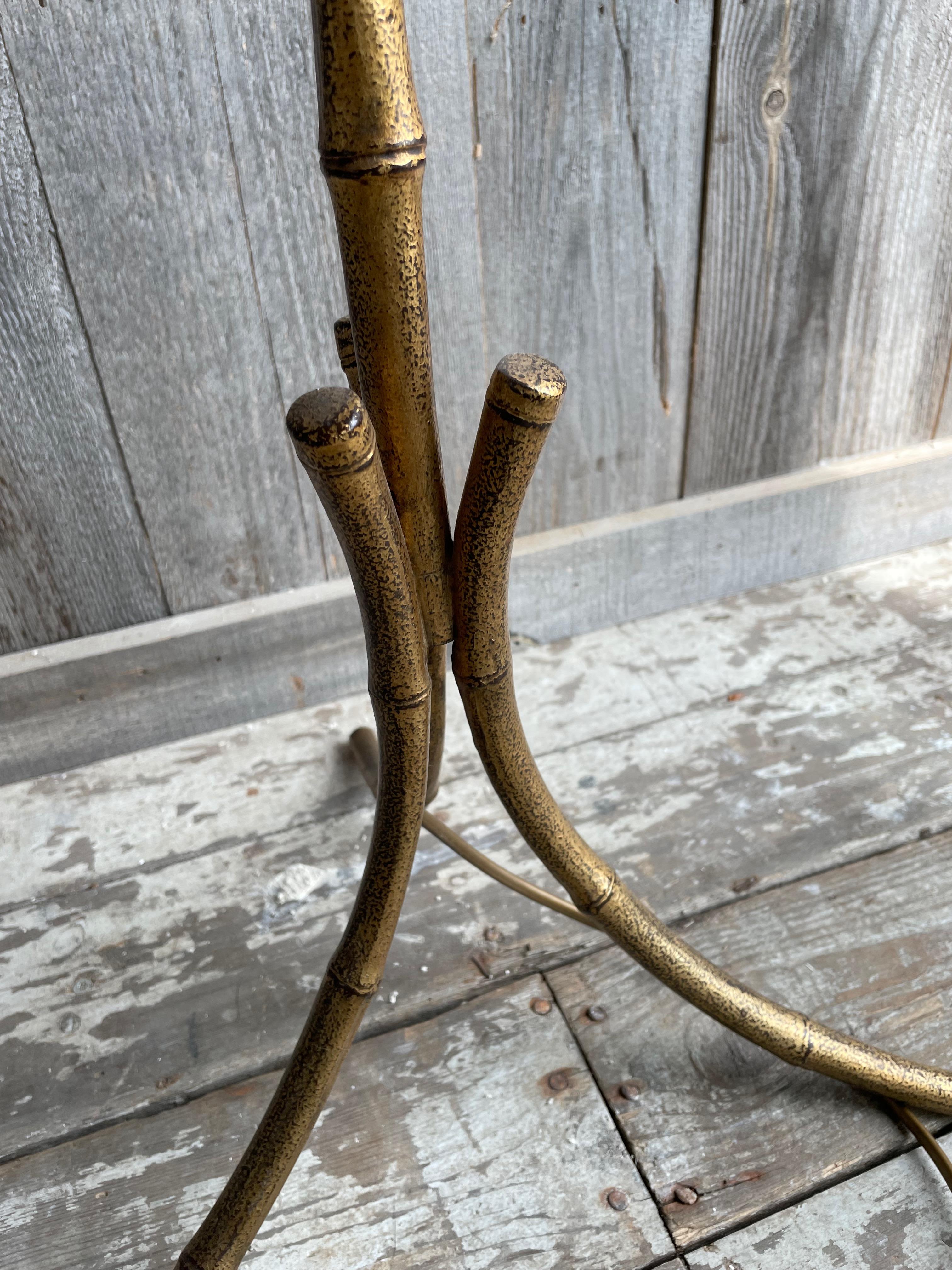 Faux bamboo floor lamp from Bagues, imitation bamboo with 3 light points and a natural lampshade, some minimal stains on the lampshade.