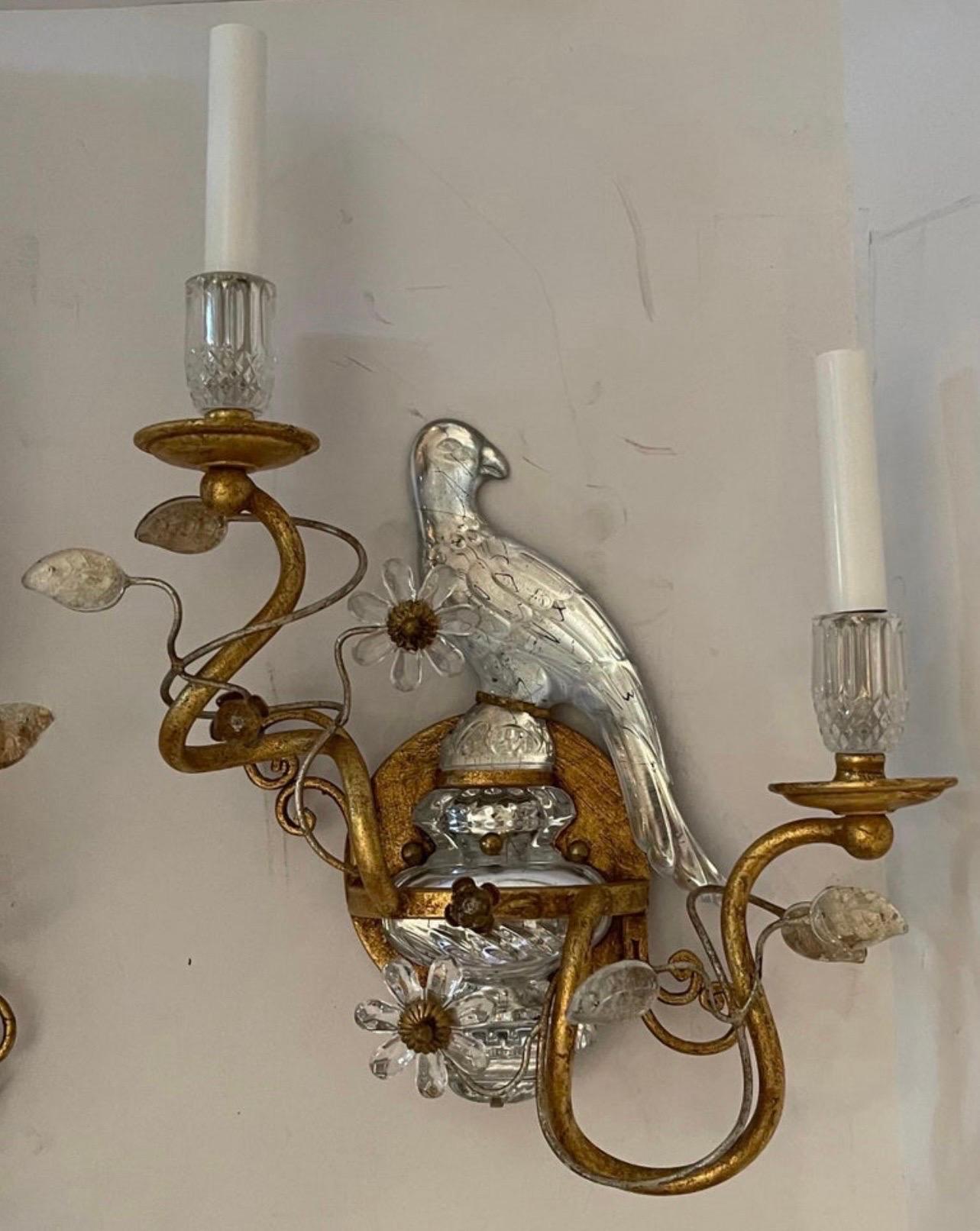 A wonderful pair of faux rock crystal / glass birds sitting on top of an urn form base, with a beautiful gold gilt patina these sconces come ready to install with all mounting hardware. They are in the manner of Maison Bagues & Sherle Wagner.
