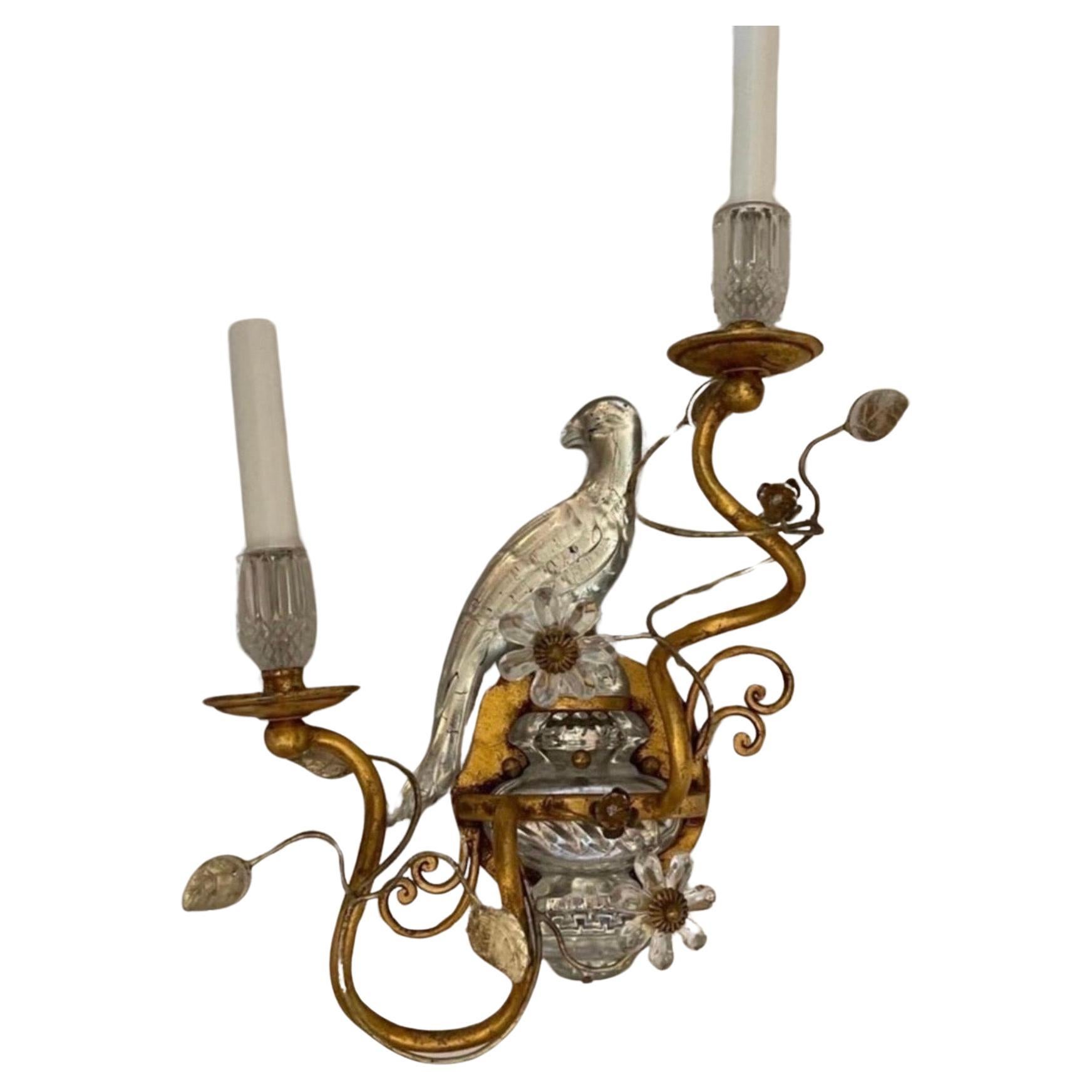 A wonderful pair of faux rock crystal / glass birds sitting on top of an urn form base, with a beautiful gold gilt patina these sconces come ready to install with all mounting hardware. They are in the manner of Maison Bagues & Sherle Wagner.