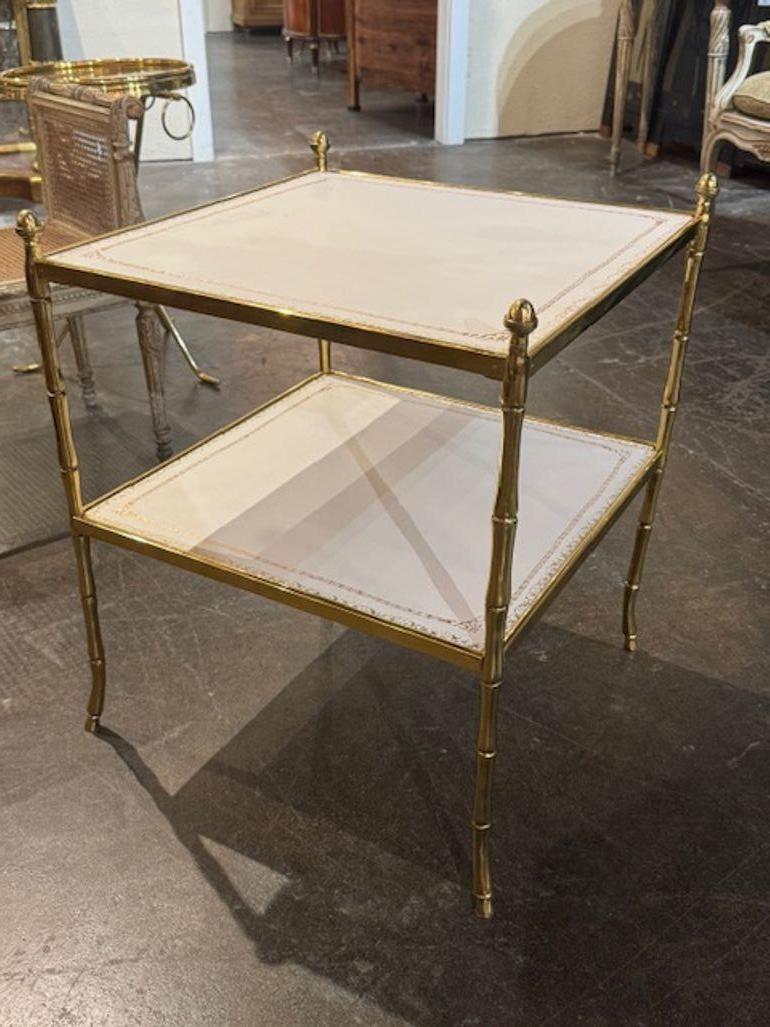 The Bagues Style Bamboo Form Table with Leather Top is a lovely table with a unique design featuring a polished bamboo form base and a leather top. A decorative piece that adds an elegant aesthetic, perfect for adding a touch of sophistication to