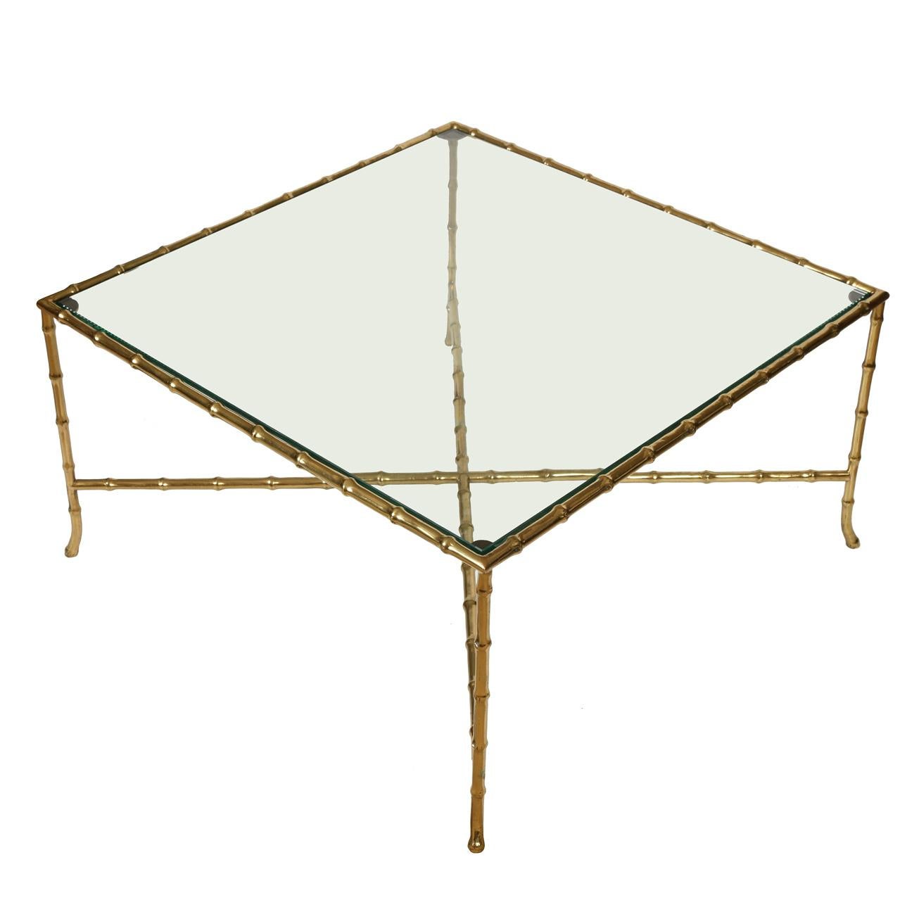 Bagues style brass bamboo square shape coffee table with X stretcher and glass top.