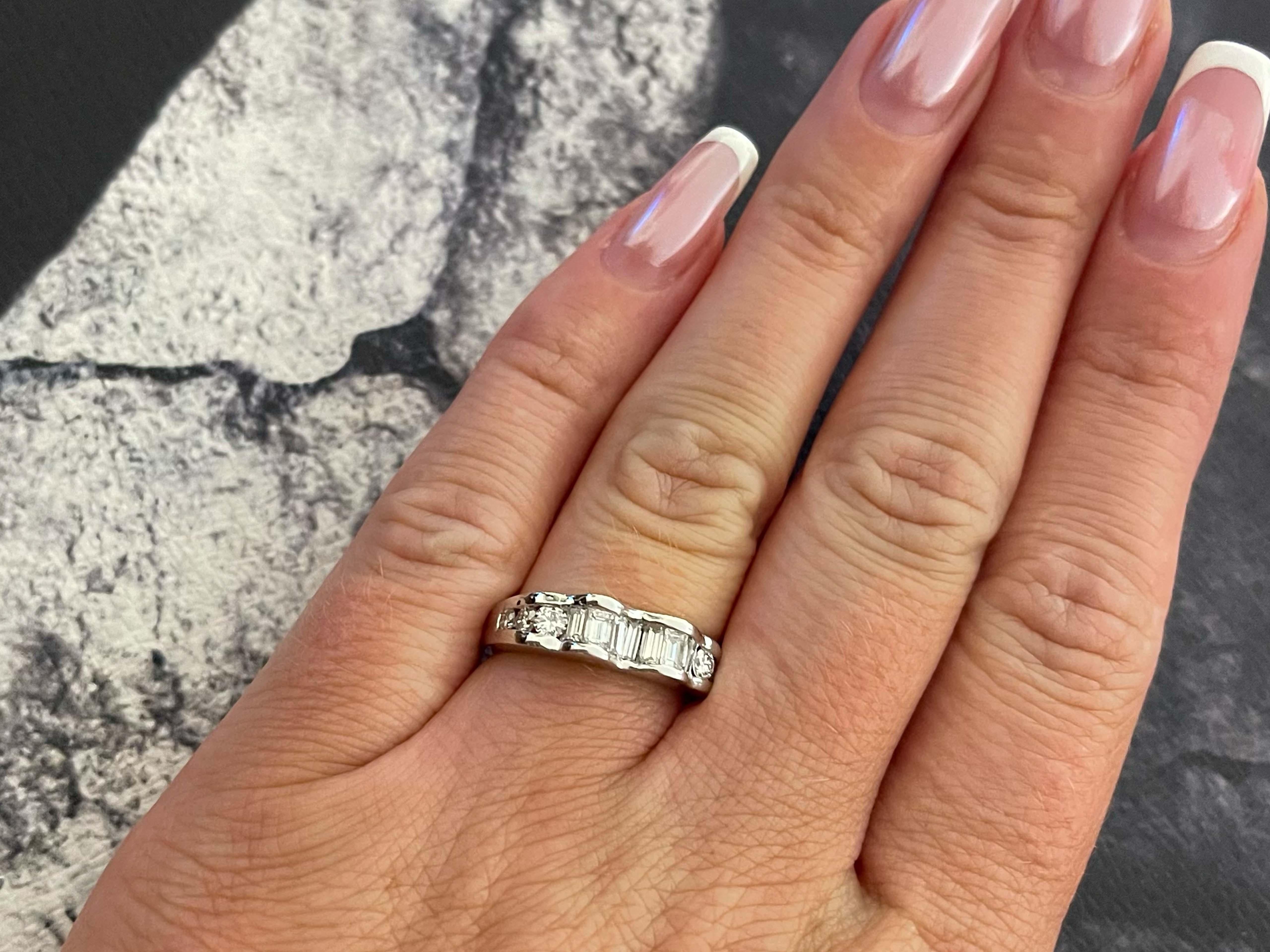 Item Specifications:

Metal: 18k White Gold 

Diamond Count: 6 brilliant cut, 7 baguette
Diamond Carat Weight: ~0.55 carats

Diamond Color: G-H

Diamond Clarity: VS2-SI1

Ring Size: 6 (resizable)

Total Weight: 5.0 grams

Stamped: 