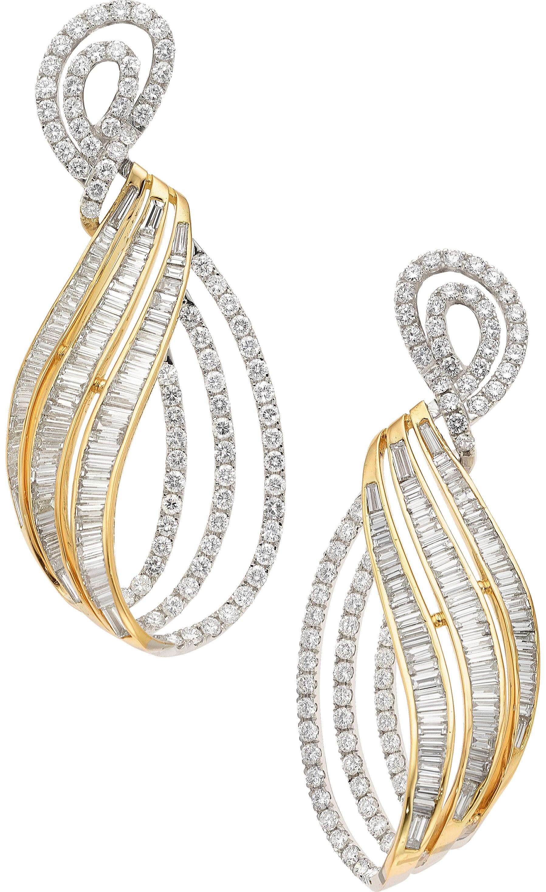 These magnificent earrings feature about 100 full and baguette-cut diamonds, weighing a total of 12.15 carats, beautifully designed and set onto 18K White and Yellow Gold. 


*Note: earrings are designed for pierced or non-pierced ears


