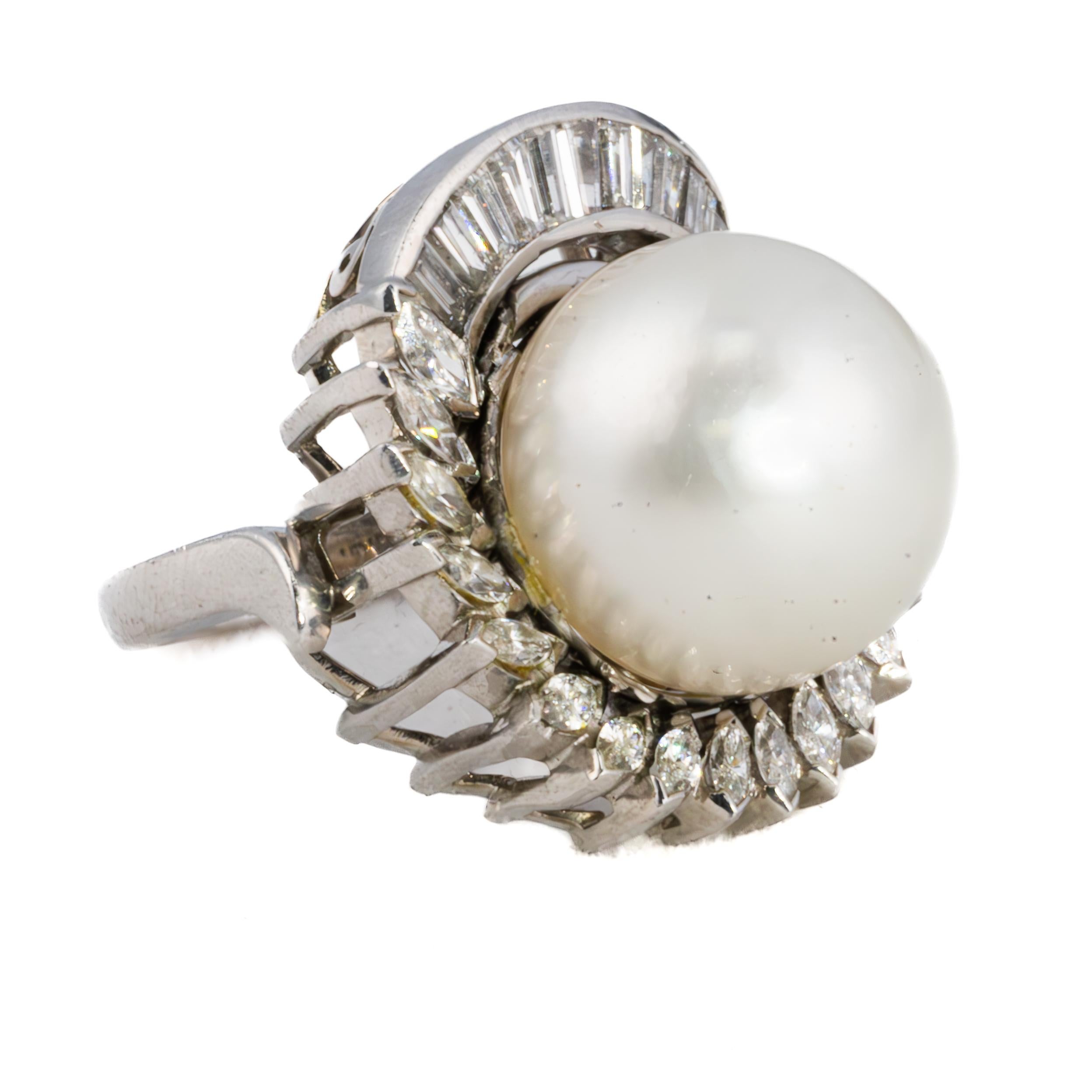 Baguette and Marquise Cut Diamond and Pearl Cocktail Ring

A statement of grace and refinement, this magnificent platinum cocktail ring features a luminous South Sea pearl at its center, its silken surface radiating with natural elegance.