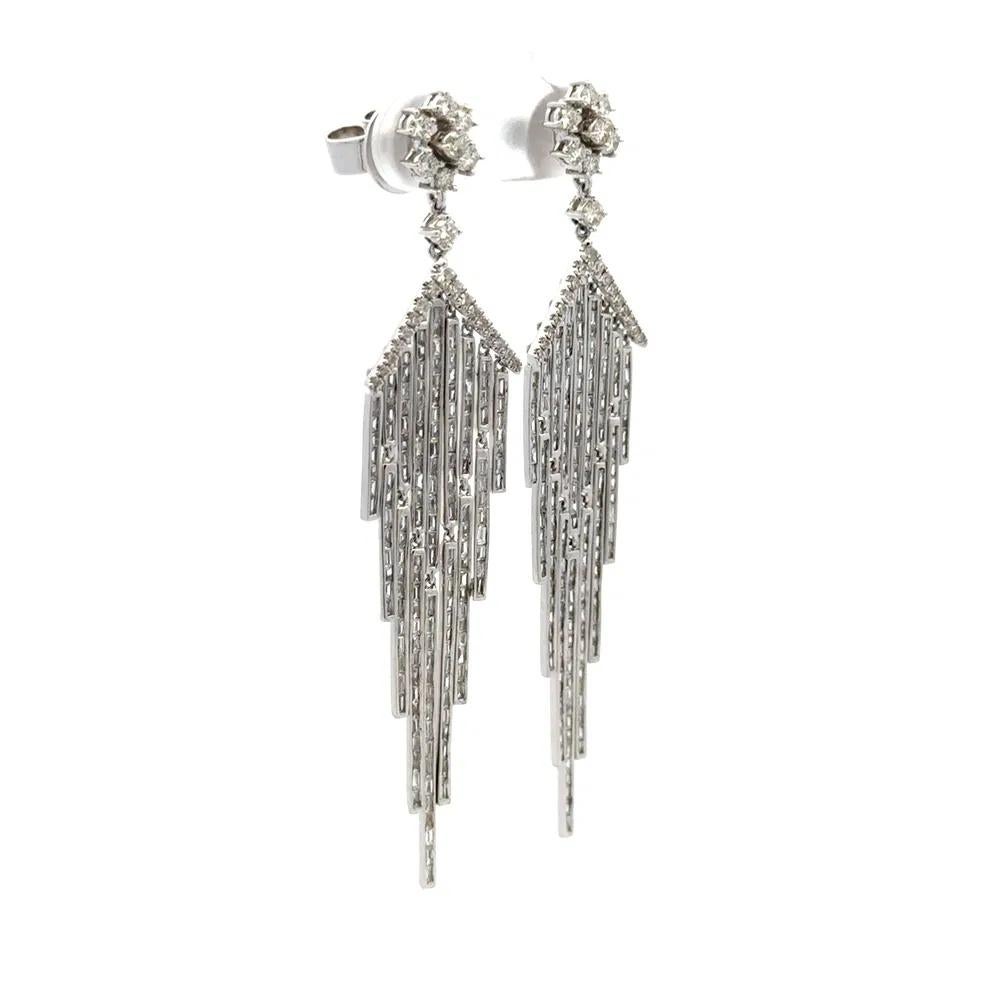 Simply Stunning! Diamond Gold Drop Chandelier Earrings. Securely Hand set with 2.43tcw Baguette and Round Brilliant Cut Diamonds, weighing approx. 2.43tcw. Beautifully Hand crafted in 18K White Gold. Measuring approx. 2.75” long. More Beautiful in